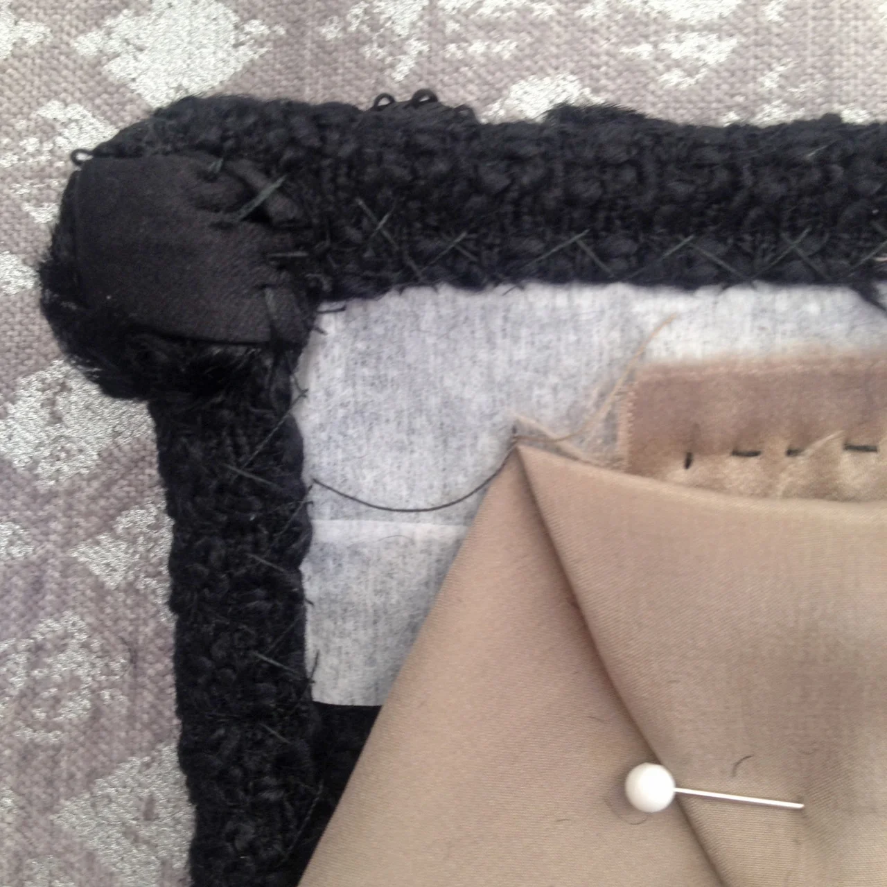 9. Secure sides/ends of trim to inside pocket with hand stitches.