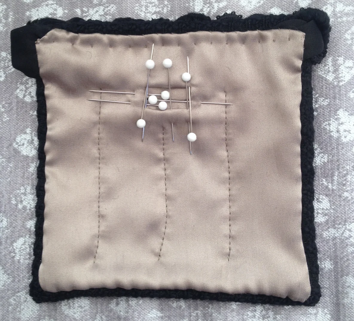 11. Prick stitch top edge of lining (this works like an under stitch). Then, cut a small opening in lining with v-cuts at each end, over center of buttonhole/welts. Fold and pin this "seam allowance" to inside, over welts, to create a welt opening in lining.