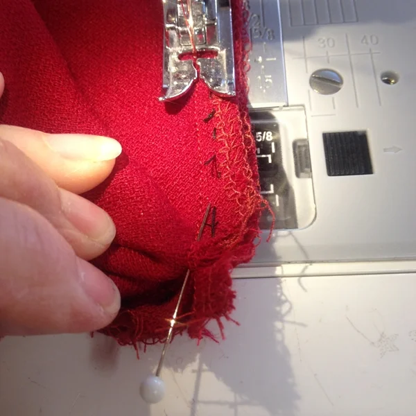 6. Stitch together along the stitch line ending at the v point, precisely and taking the pins out as you go.