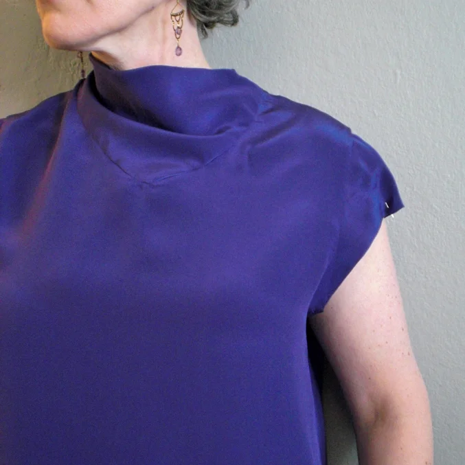 I've pinched out 1/2" (1" total from the arm for a closer fitting sleeve.