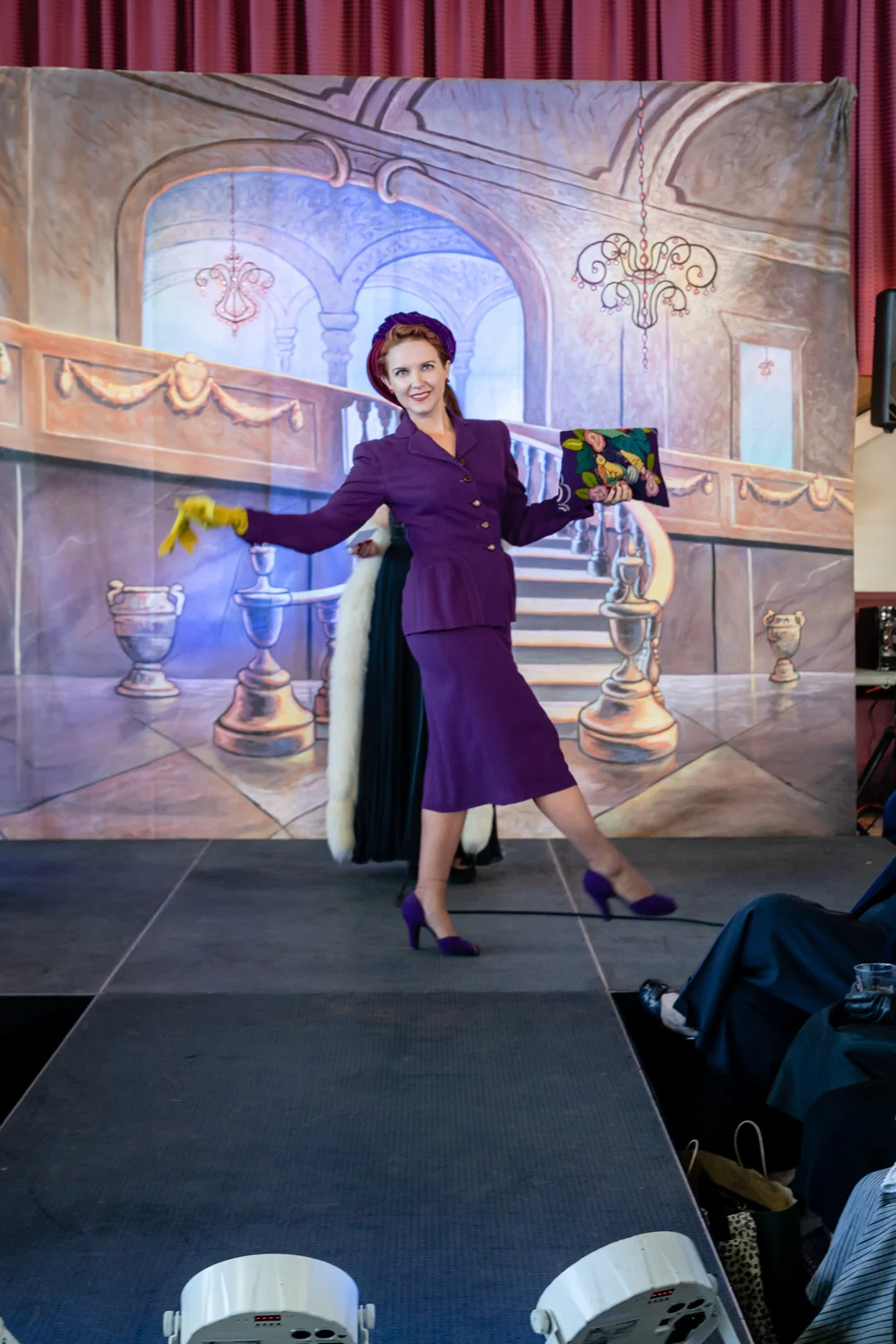 Halsey (AKA @HalseyAndTheHiHats on Insta) wears a purple 1940’s suit with coordinating suede shoes, yellow gloves a needlepoint clutch and vintage hat.
