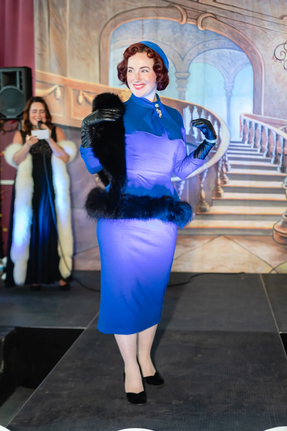 Straight out of Mad Men, she (AKA @dee2the9s on insta) stepped onto the stage. My goodness, this cobalt blue suit with fur trim and matching hat was out-of-this-world!