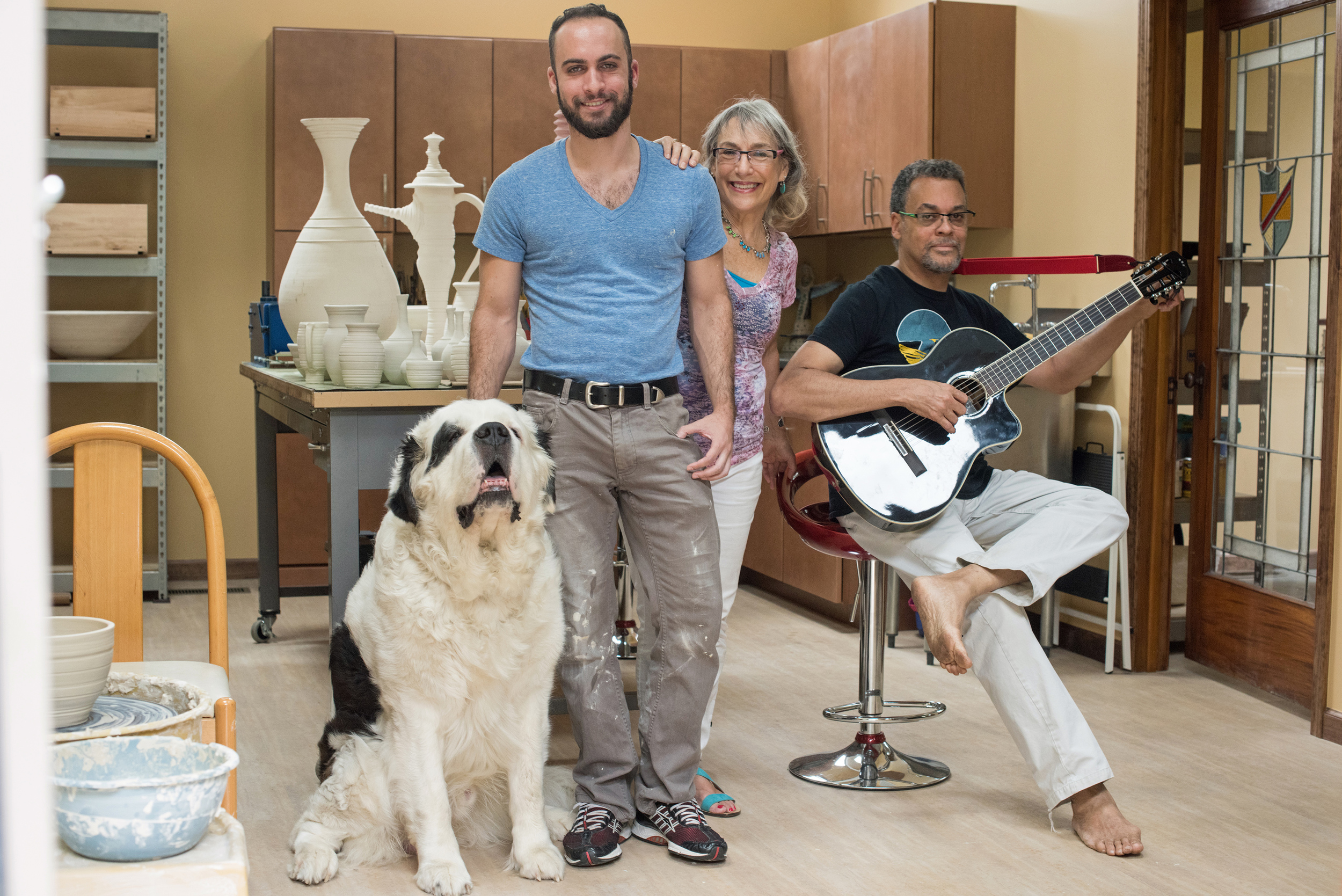 Spencer and Barbara Barefield with their Saint Bernard Devo, sharing some love, drool and fur, and Spencer Barfield III, sharing some great jazz on his new guitar. Photo by Andrew Potter