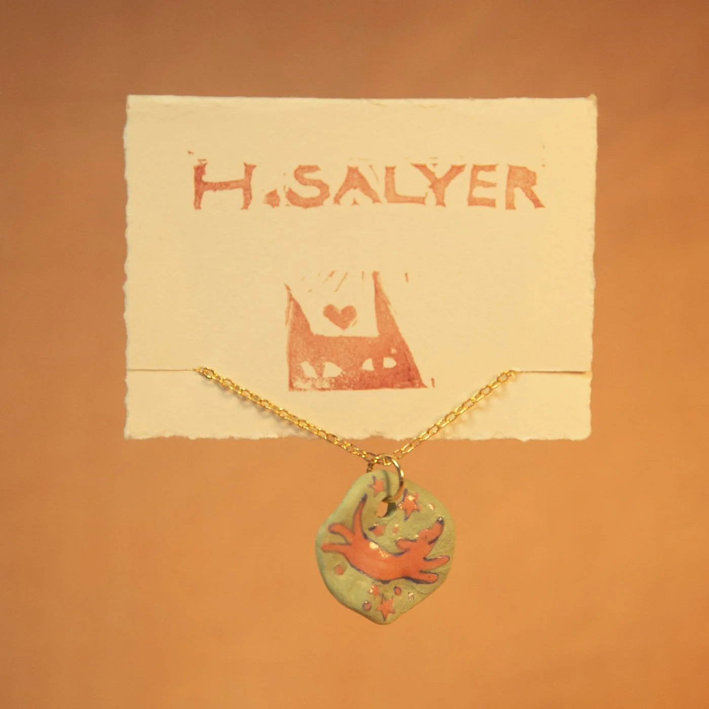flying weenie necklace.jpg