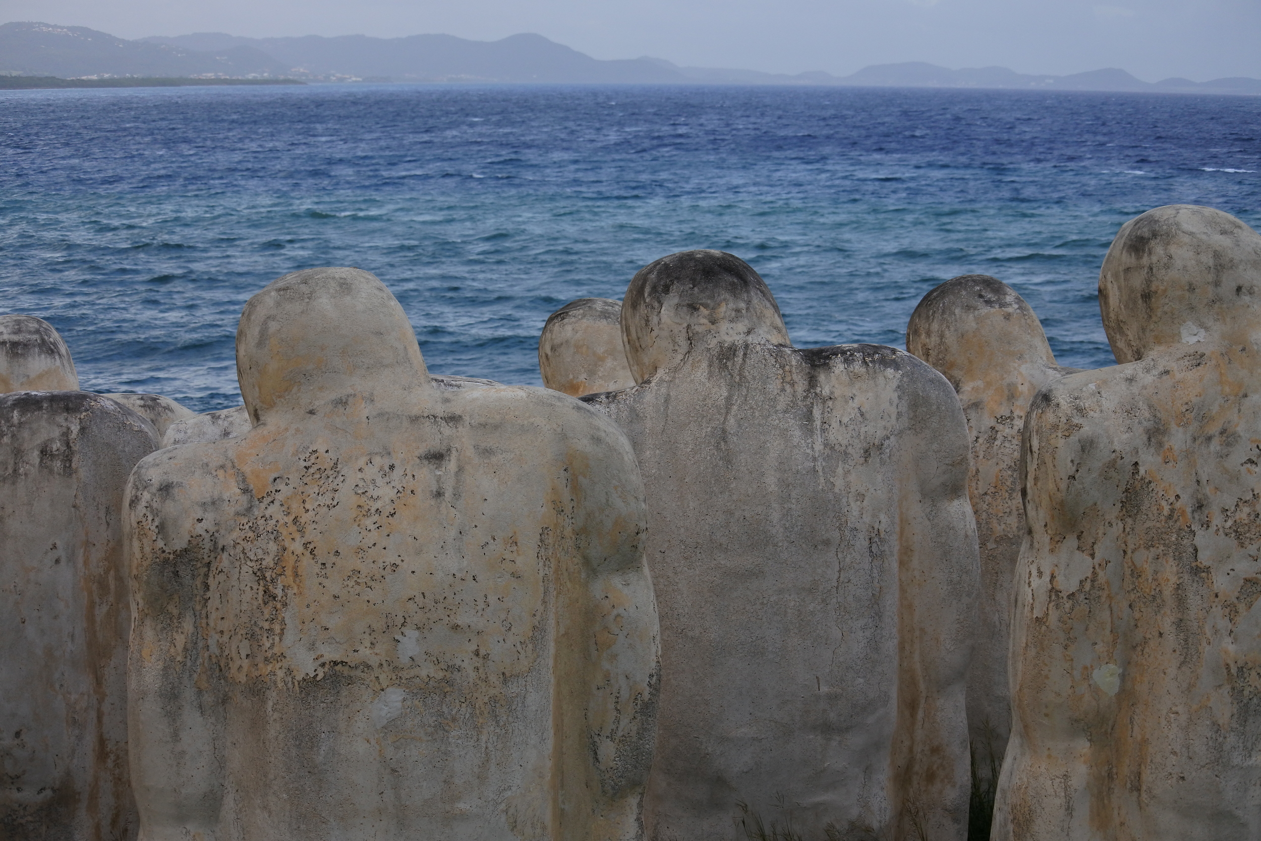 The statues all look towards the sea that took their lives.