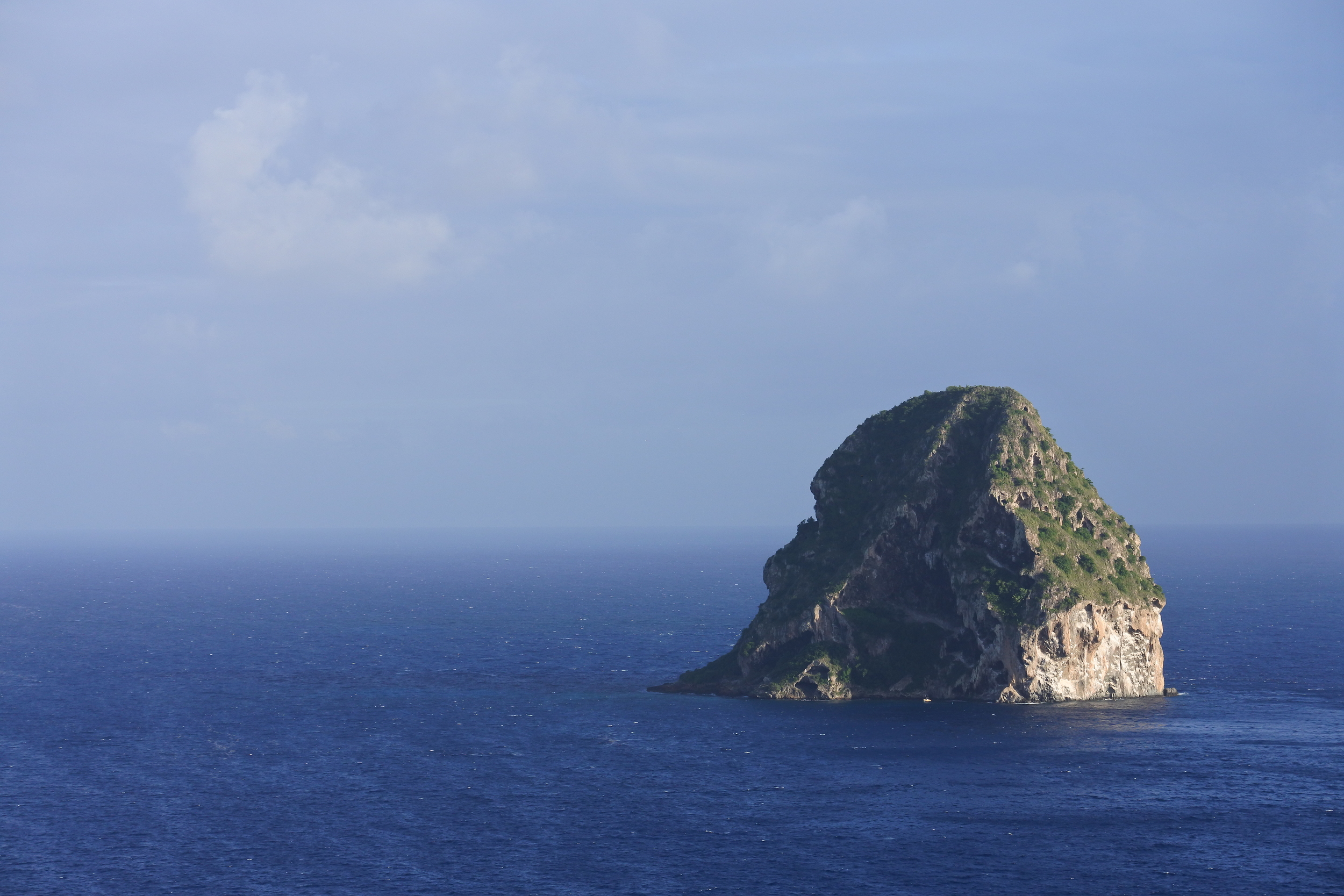 Diamond Rock, sits ominously off the coast of Le Diamant like the lair of a Bond film villain.