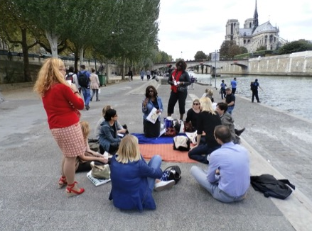 Friends, a blanket, and a good wine is all you need for a great time on the Seine.