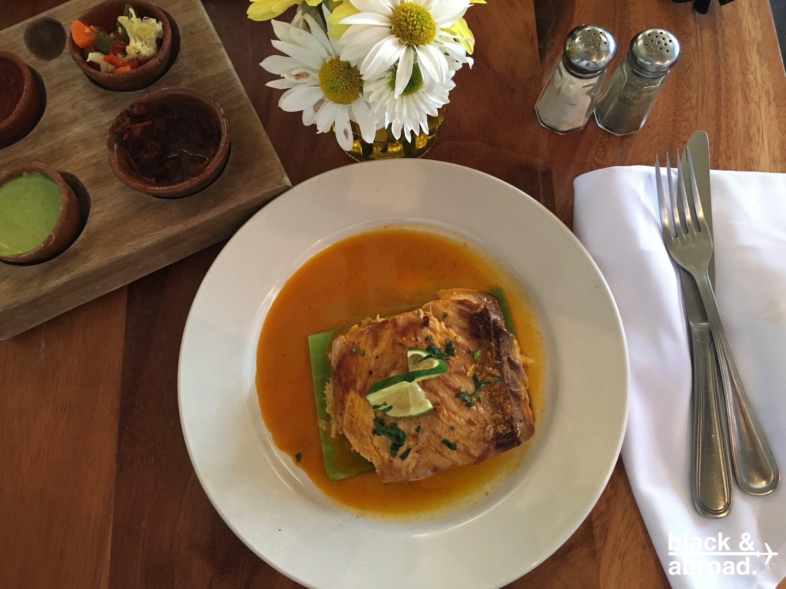 The Pescado Garifuna - Seared Mahi Mahi served atop a green plantain tamale with a coconut based tomato sauce.