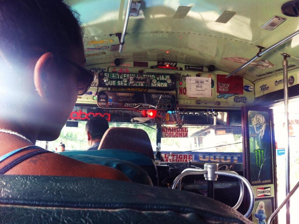 3. Sitting on the foursome seat in the Salvadoran chicken bus, as taken by my friend Anne, 2015