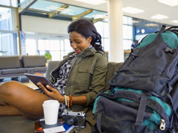 best-airports-for-layover-woman-waiting-for-flight.jpg.rend.tccom.616.462.jpeg