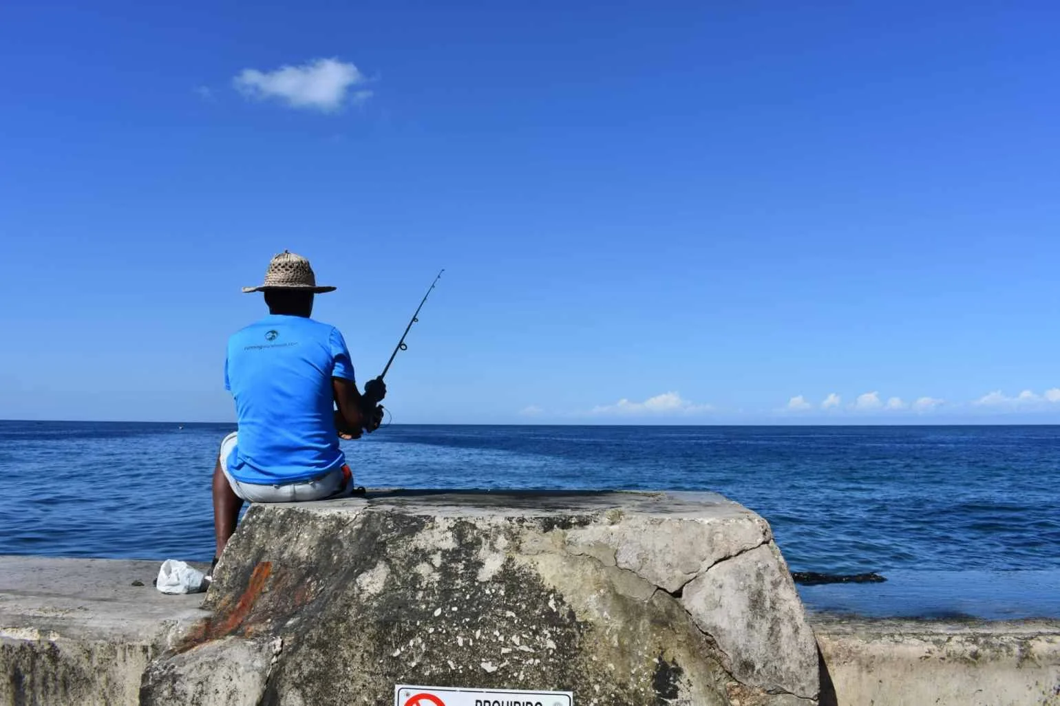 A fisherman on El Malecon in Havana, Cuba looking for his next catch