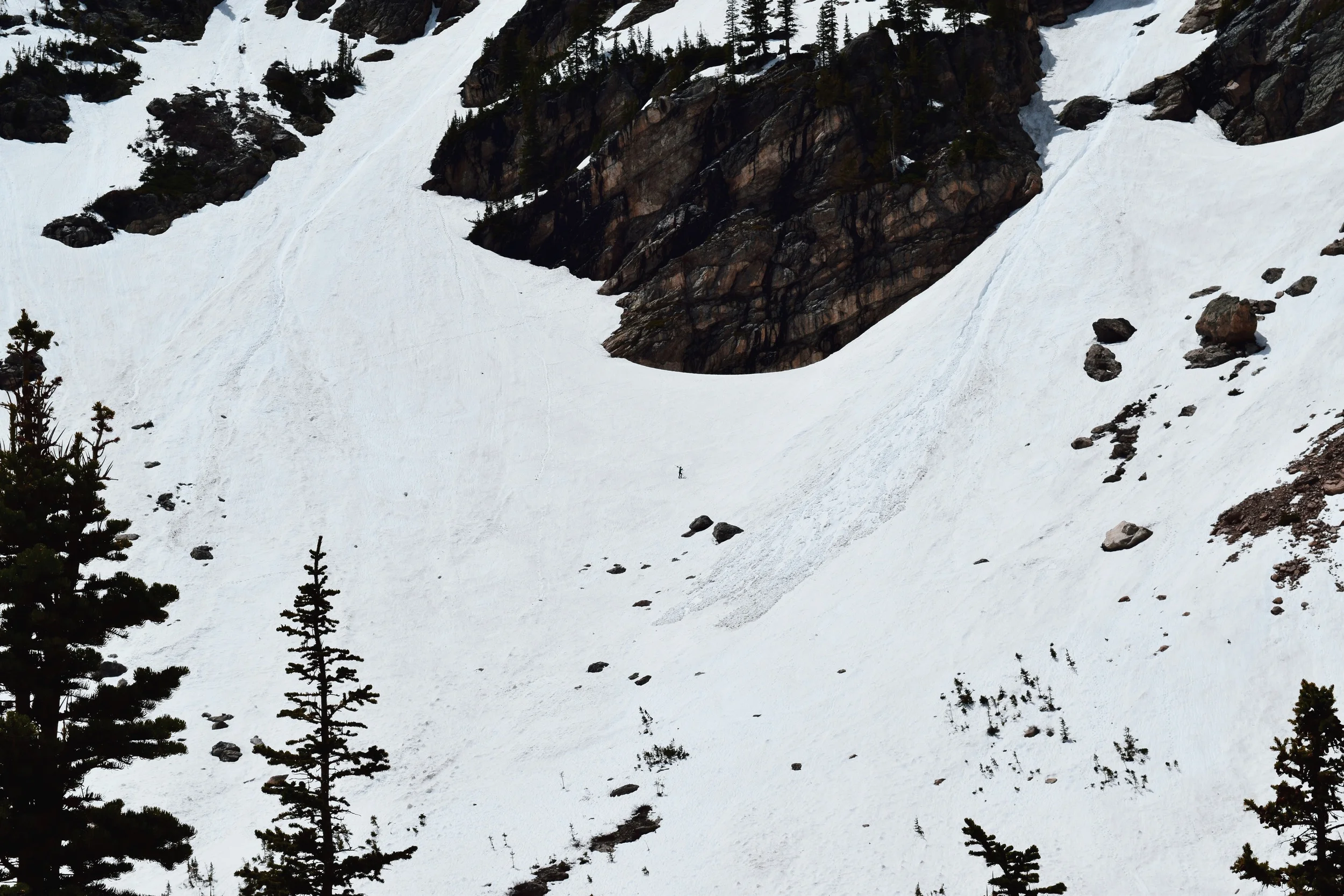 The dot in the middle there is a backcountry skier with his skis strapped to his back