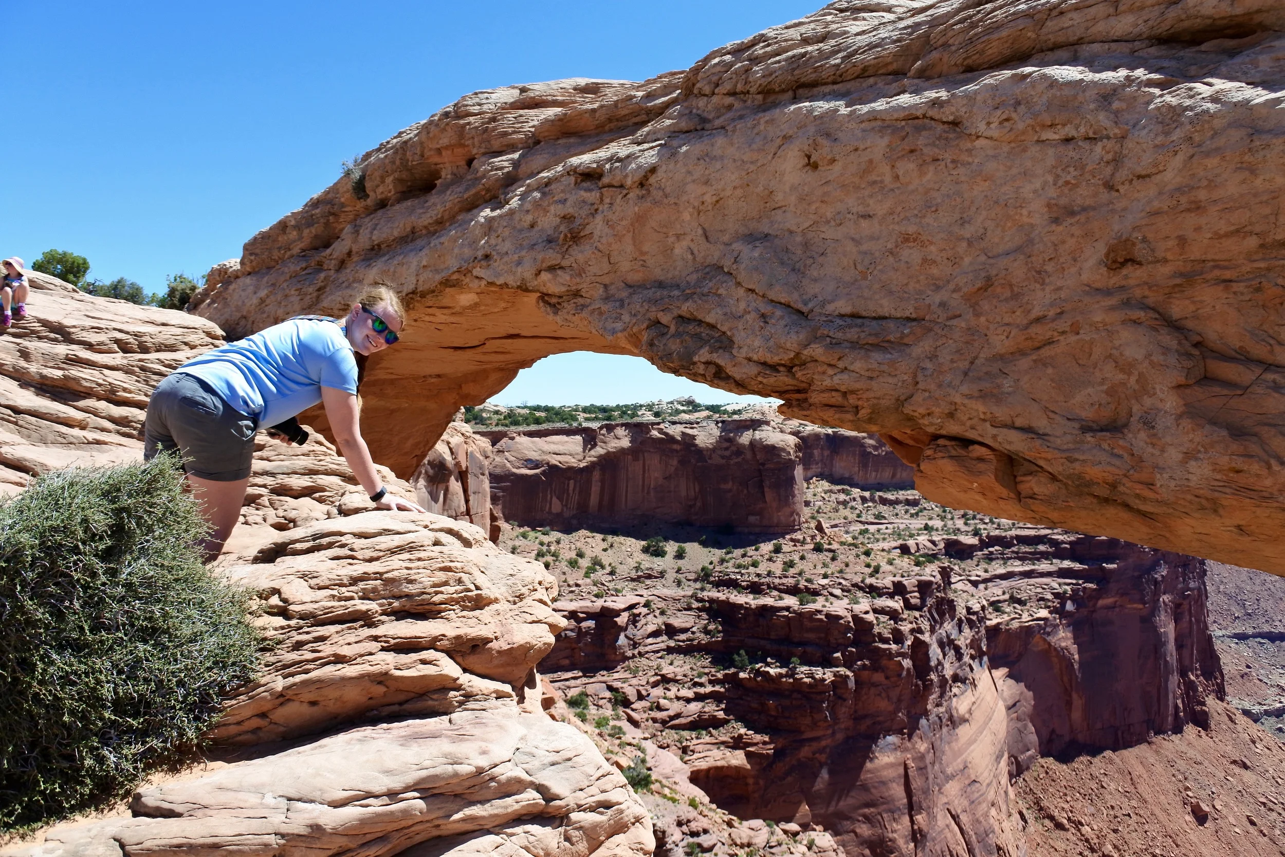 Checking out the sheer drop off below Mesa Arch. 