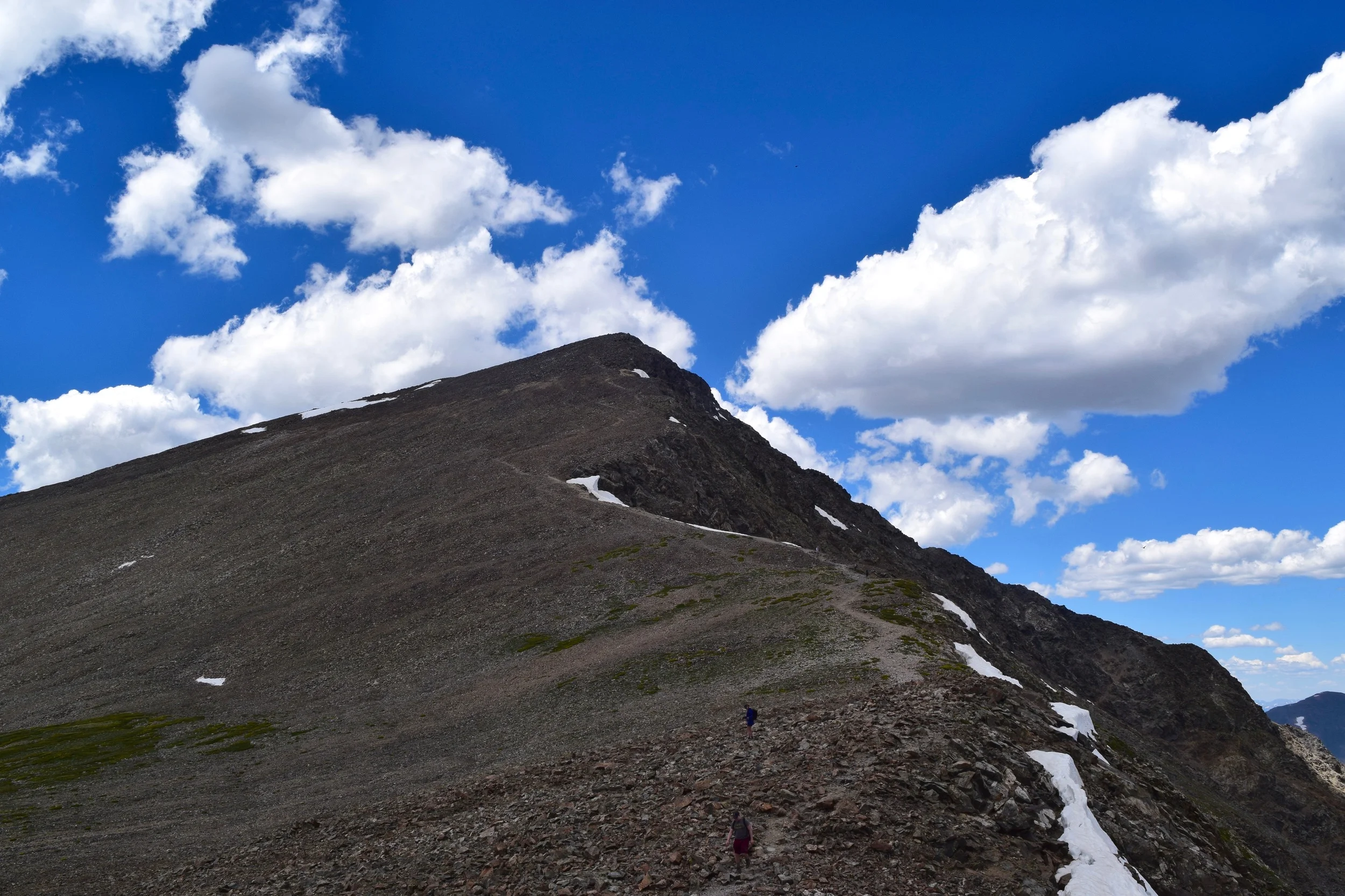 All the way down and into the saddle between the two peaks