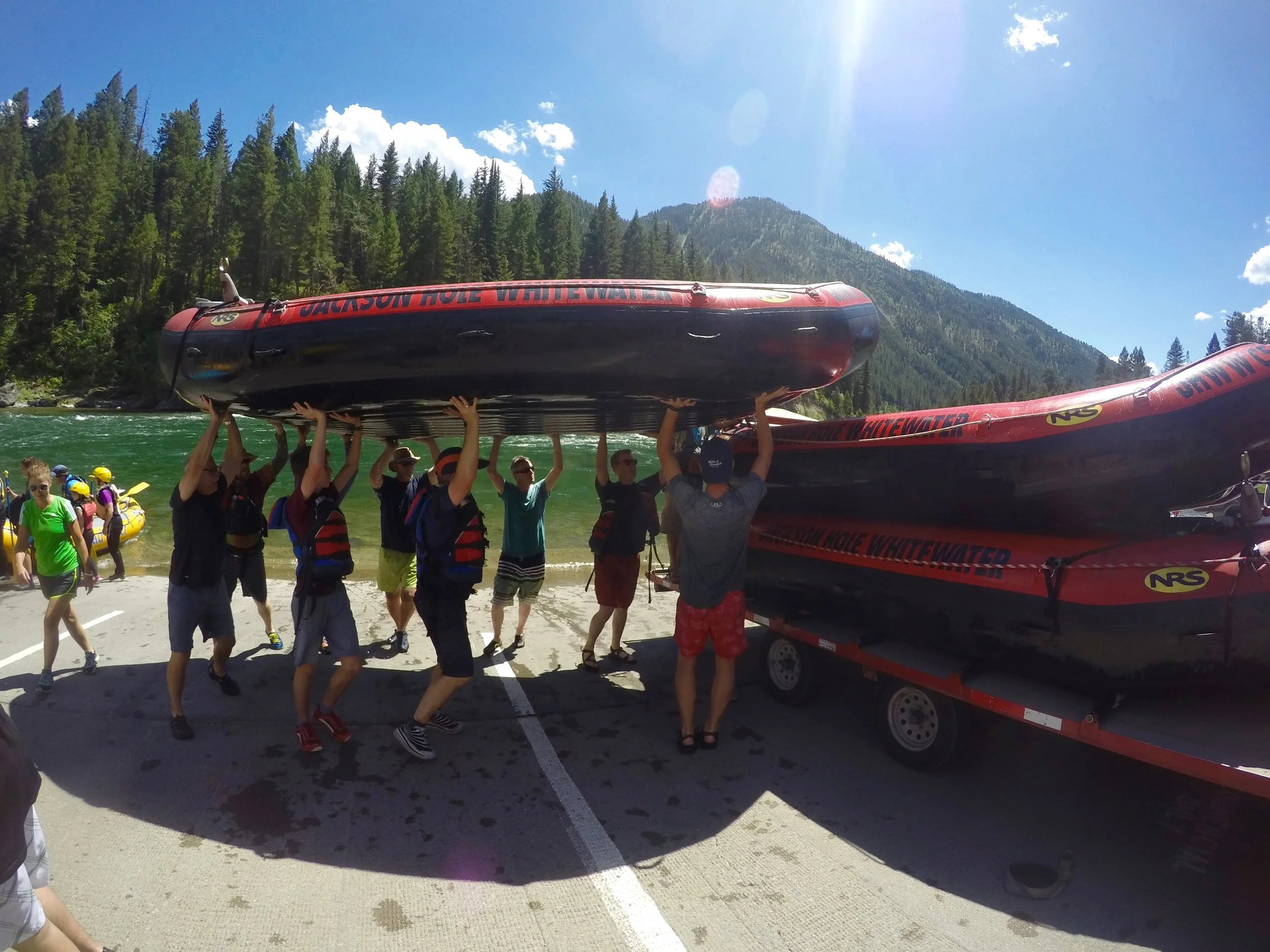 The boys had to help put all the rafts on the trailers