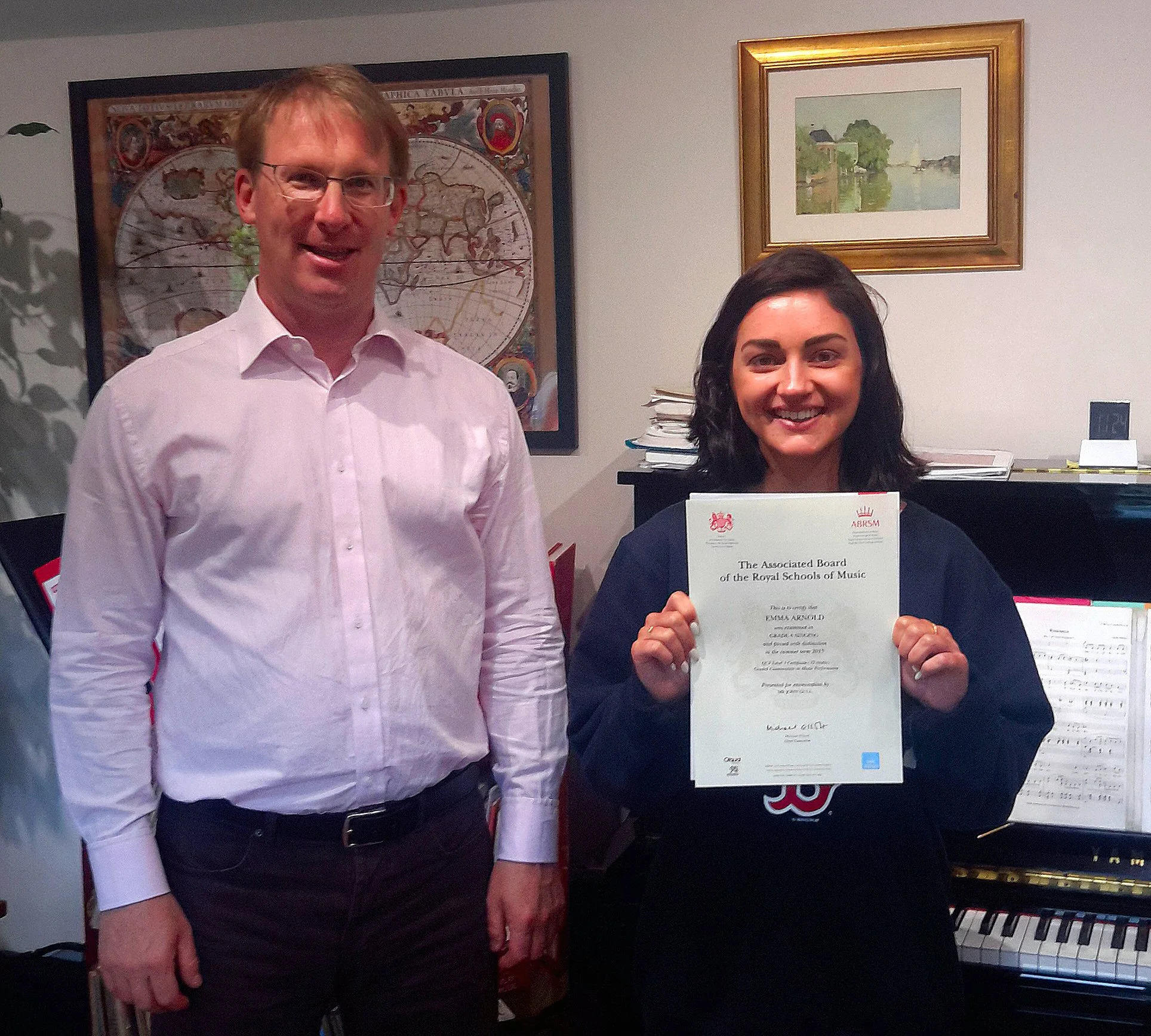 John with Emma Arnold following her distinction at Grade 8 Singing