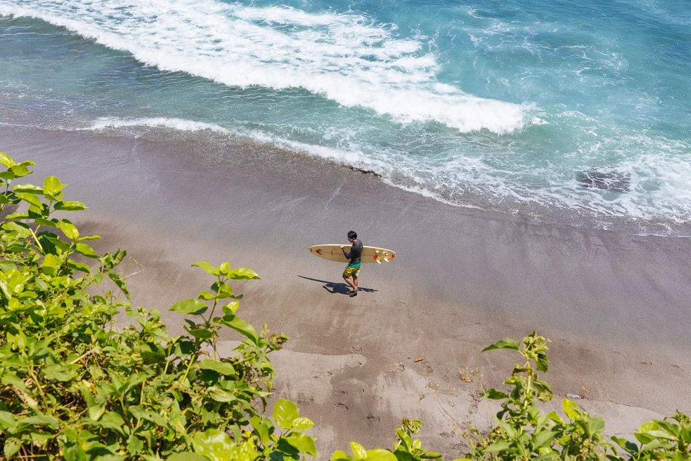 Surfer with his board