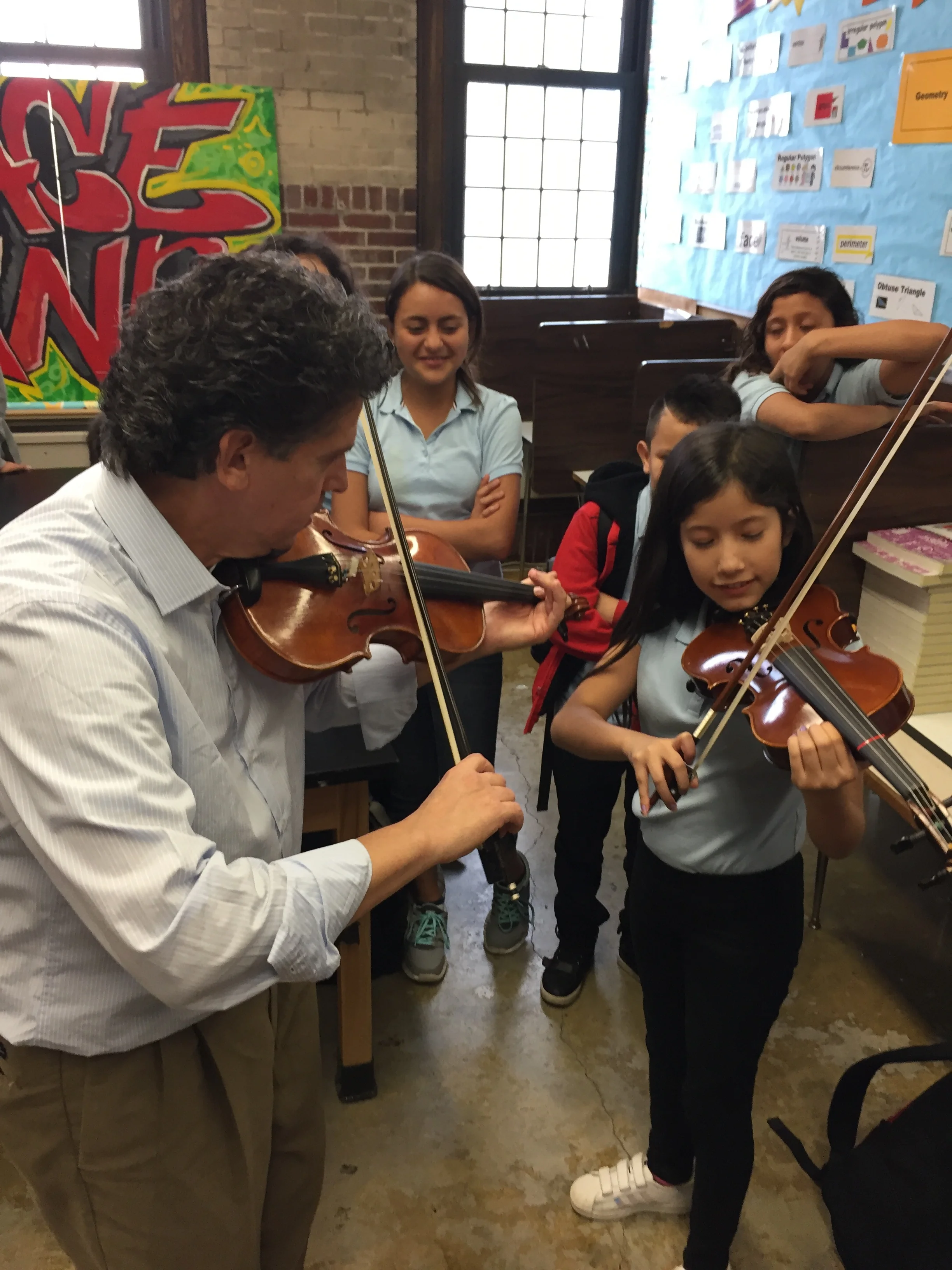 STRING SECTION: Students at Grace A. Dunn Middle School in Trenton are learning the violin from José Gregorio Sanchez Rodriguez, who is a product of the highly successful El Sistema program in Venezuela. Rodriguez also teaches at Westminster Conservatory in Princeton.