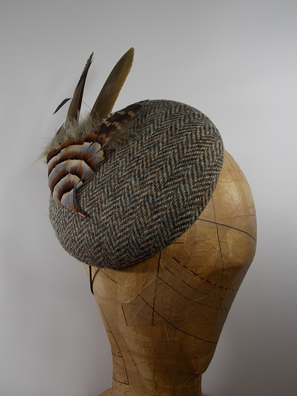 Brown herringbone tweed hat with feather bird