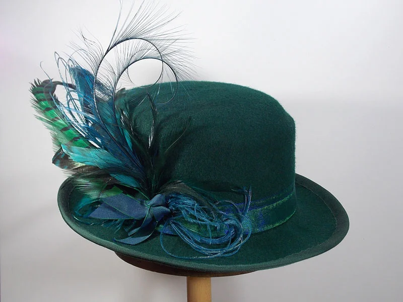 Green fedora with large feather trim