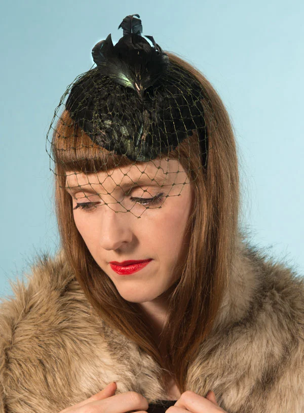Petrol green cocktail hat with bird and veil