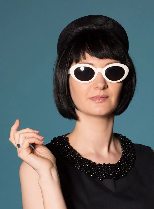 Jackie O style black straw pillbox hat with flowers