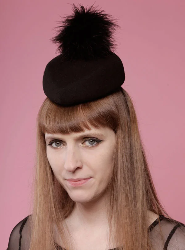 Black felt hat with feather pompom and studs