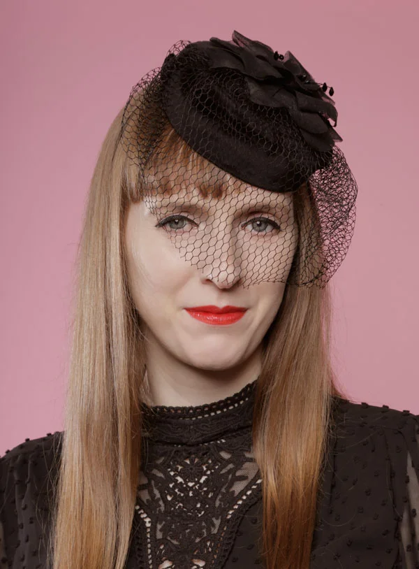Black velvet pillbox with veil and flower