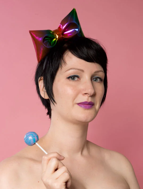 Metallic rainbow pvc padded bow on black hairband