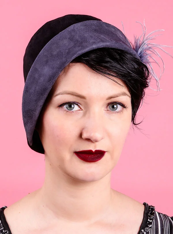 Grey and black 20s style fabric cloche hat with feathers