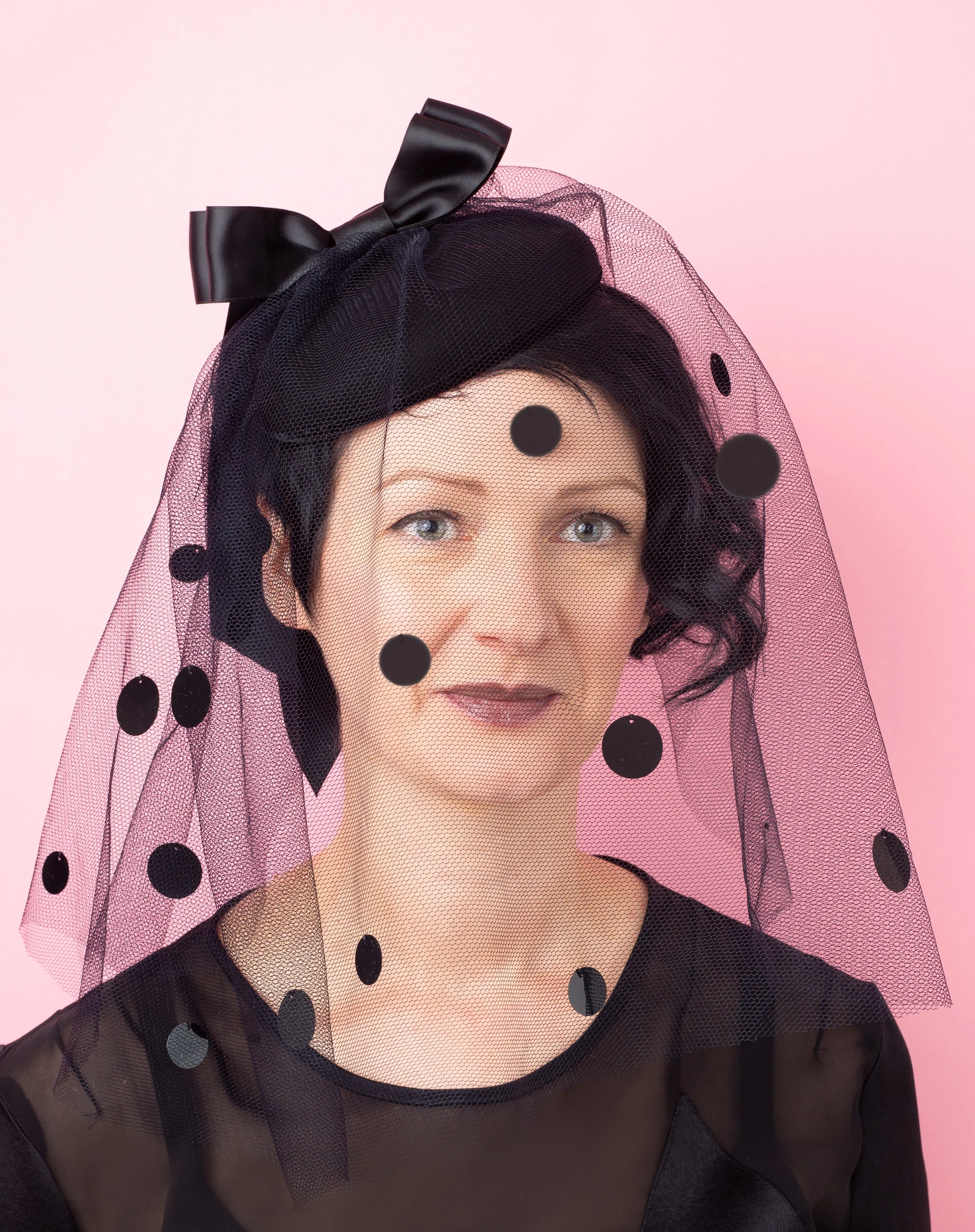 Black button hat with tulle spotty veil
