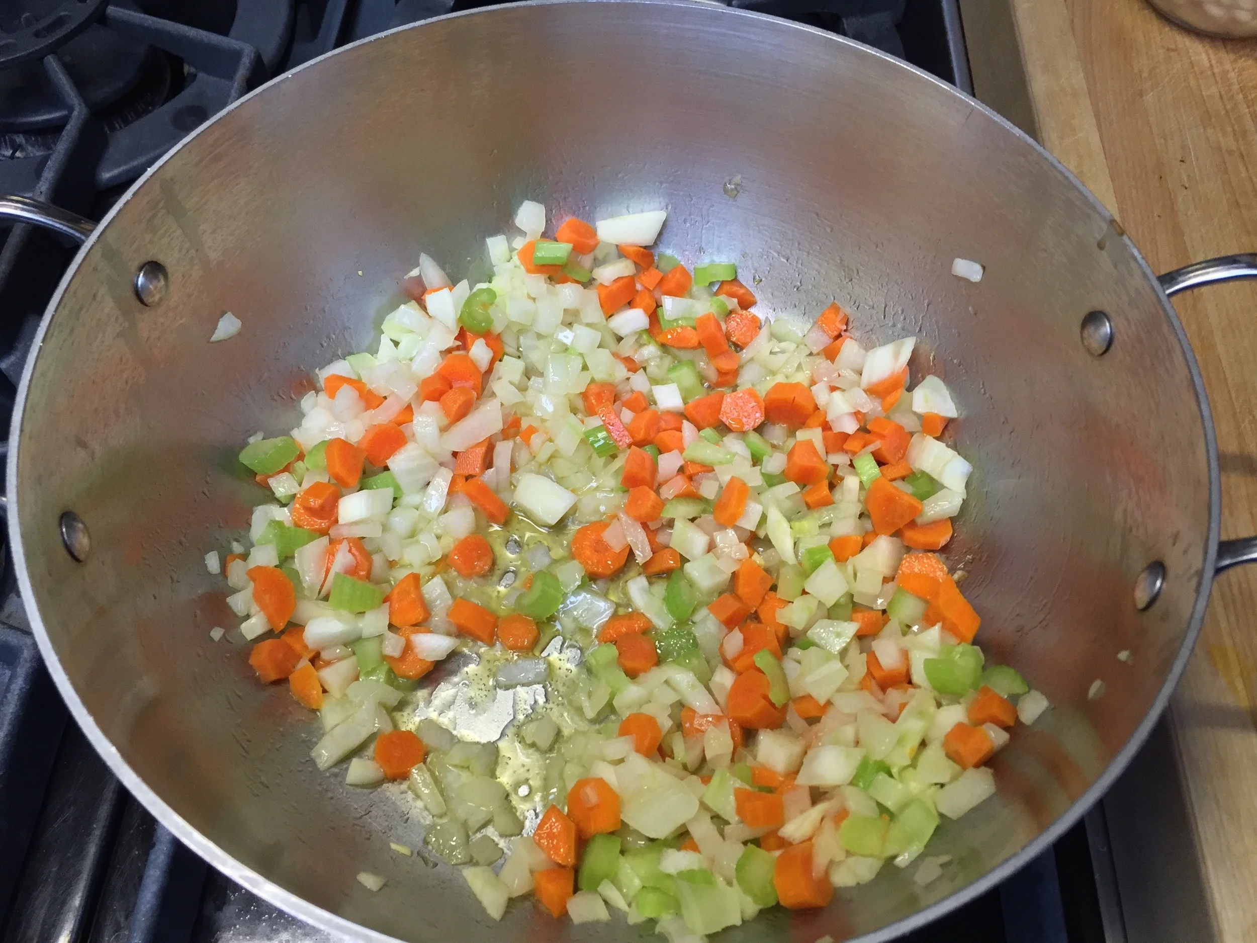 The mirepoix - onion, celery and carrots sautéing in olive oil for 5 minutes. 
