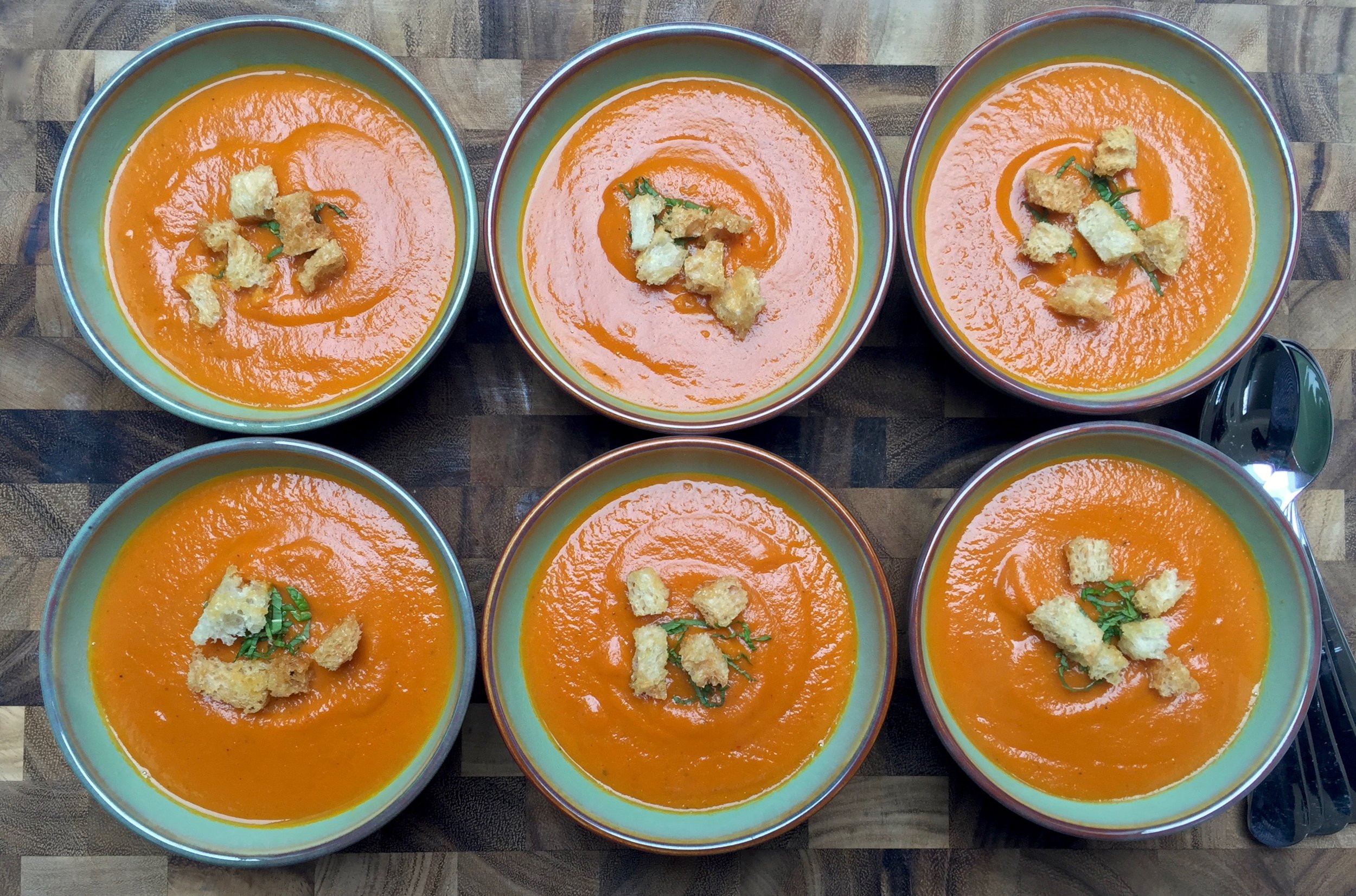 Roasted Carrot-Ginger Soup garnished with croutons and mint is ready to pass around...