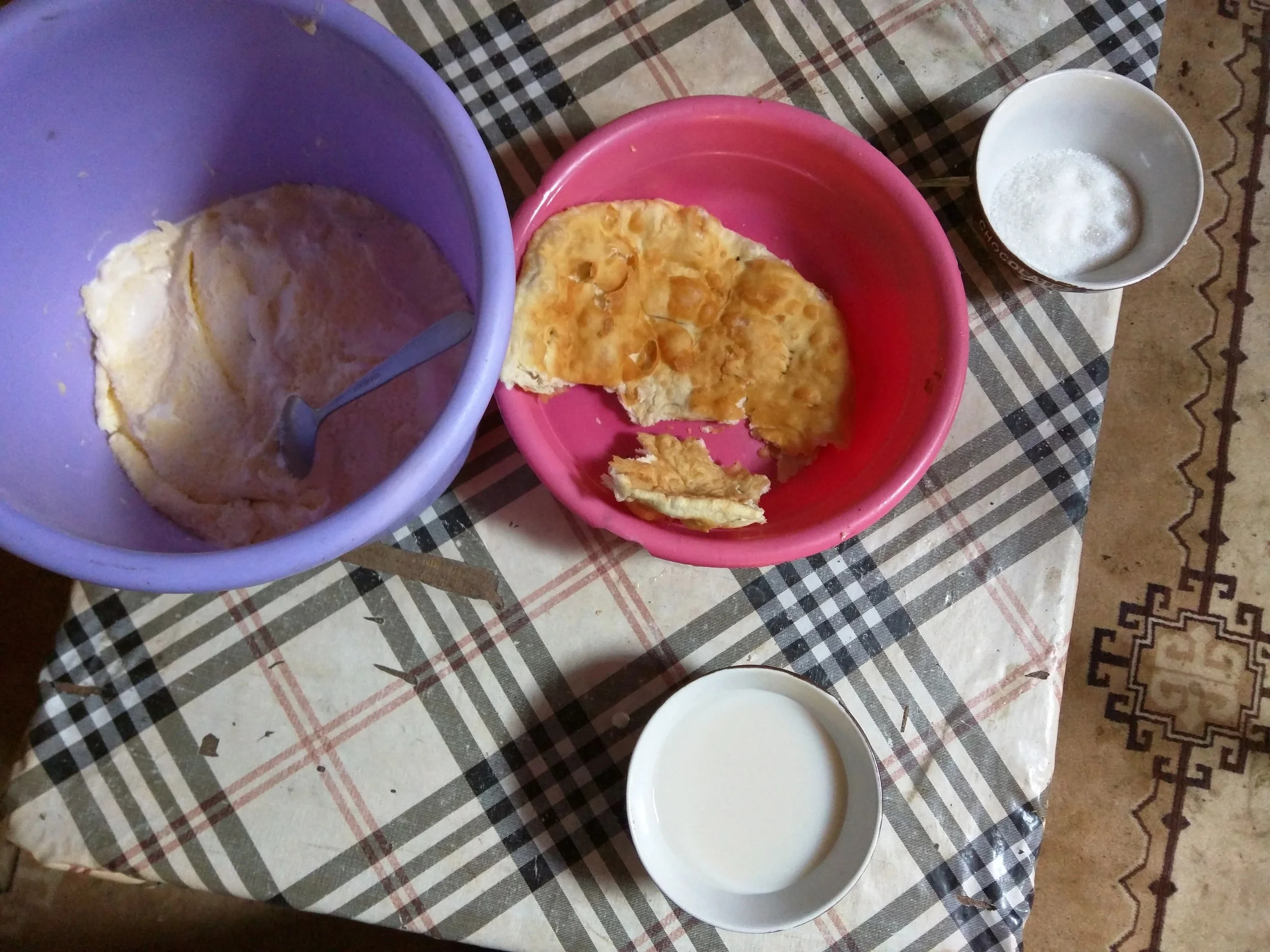 Breakfast - fried flat bread, dried cream, sugar and milk tea.