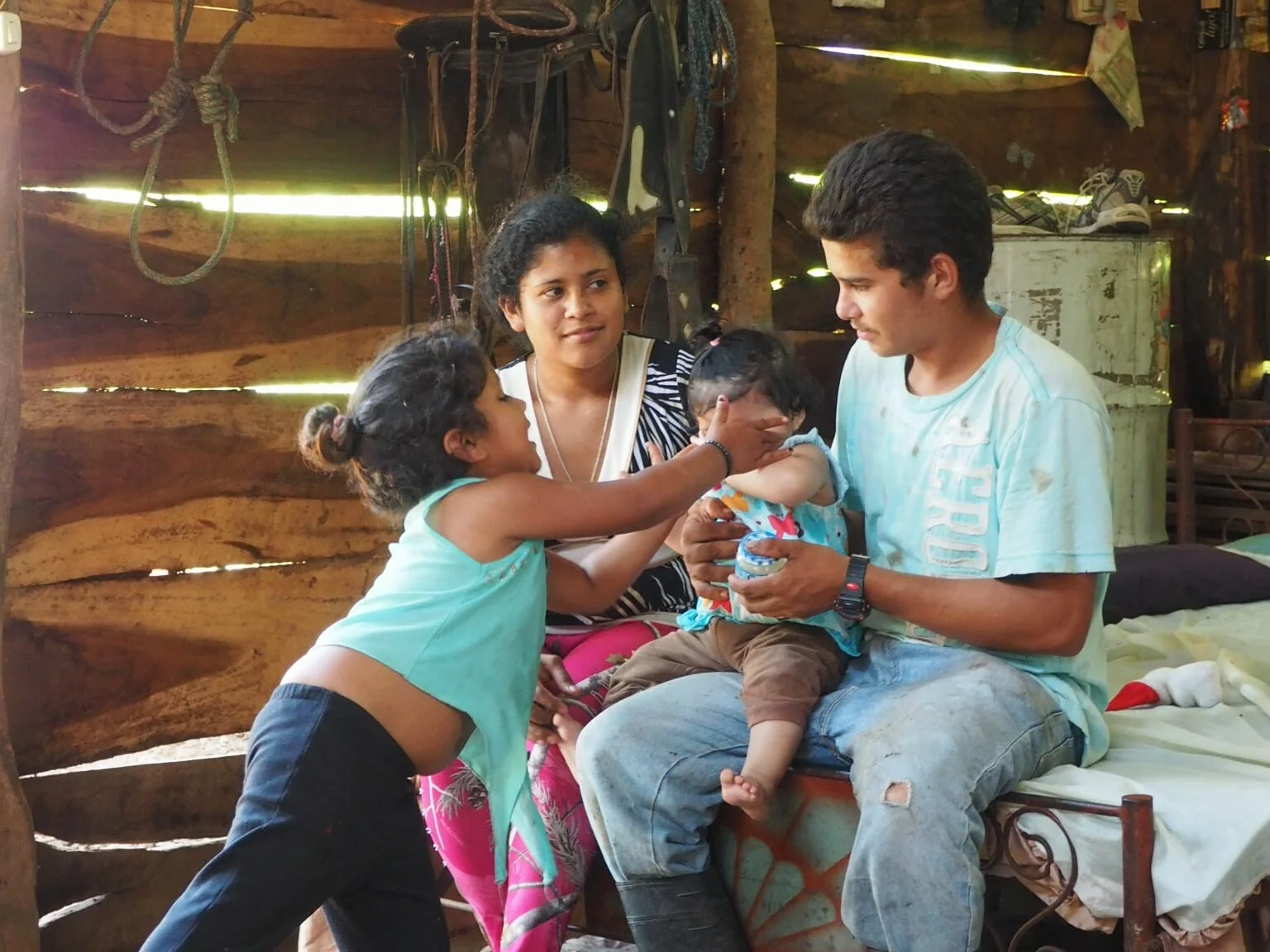 This is Alejandro (23)&nbsp;with his wife Maria (19), their infant daughter and Alejandro's niece. They live in a section of Isiquí&nbsp;called El Carizo, which is only reachable via a steep, 30min hike from the center of the village. They have no r…