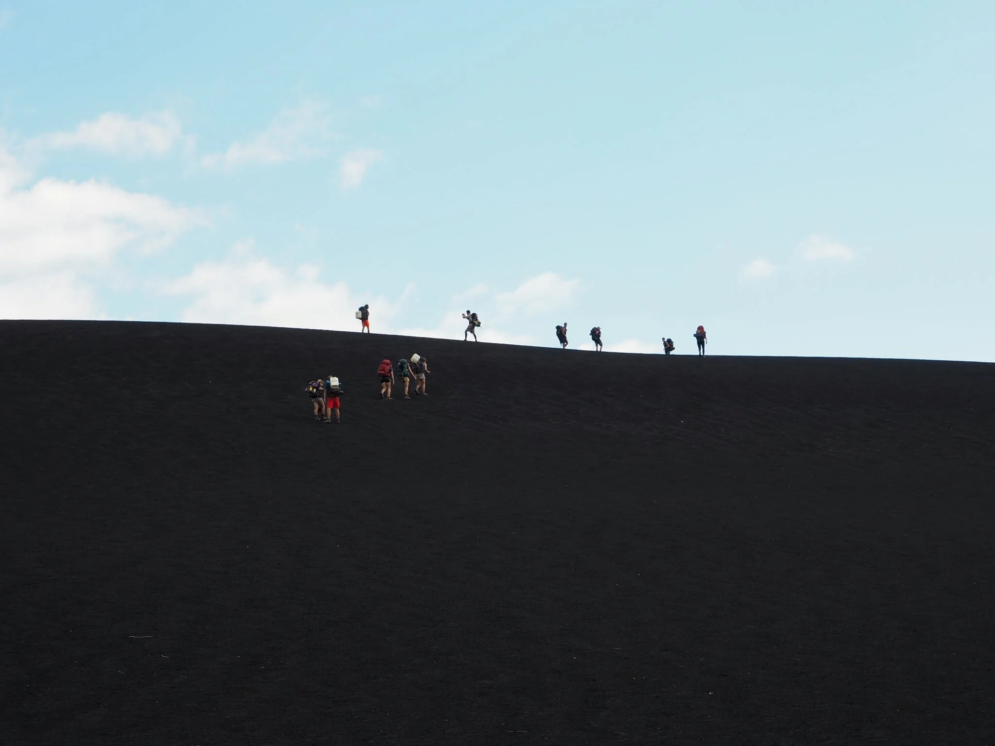 At the foot of Cerro Negro after a grueling 10 hour trek. We were running out of water because the kids had decided that there was no need to top up our supply for the final 7km, which turned out to take a bit longer than the anticipated 2 hours. Fo…