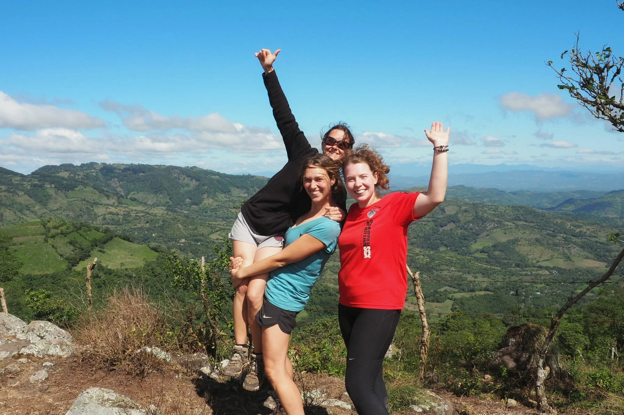 My co-PMs, without whom I would not have survived. This picture was taken on day three of the trek, on the top of the first real mountain. We still look very white, and very clean!
