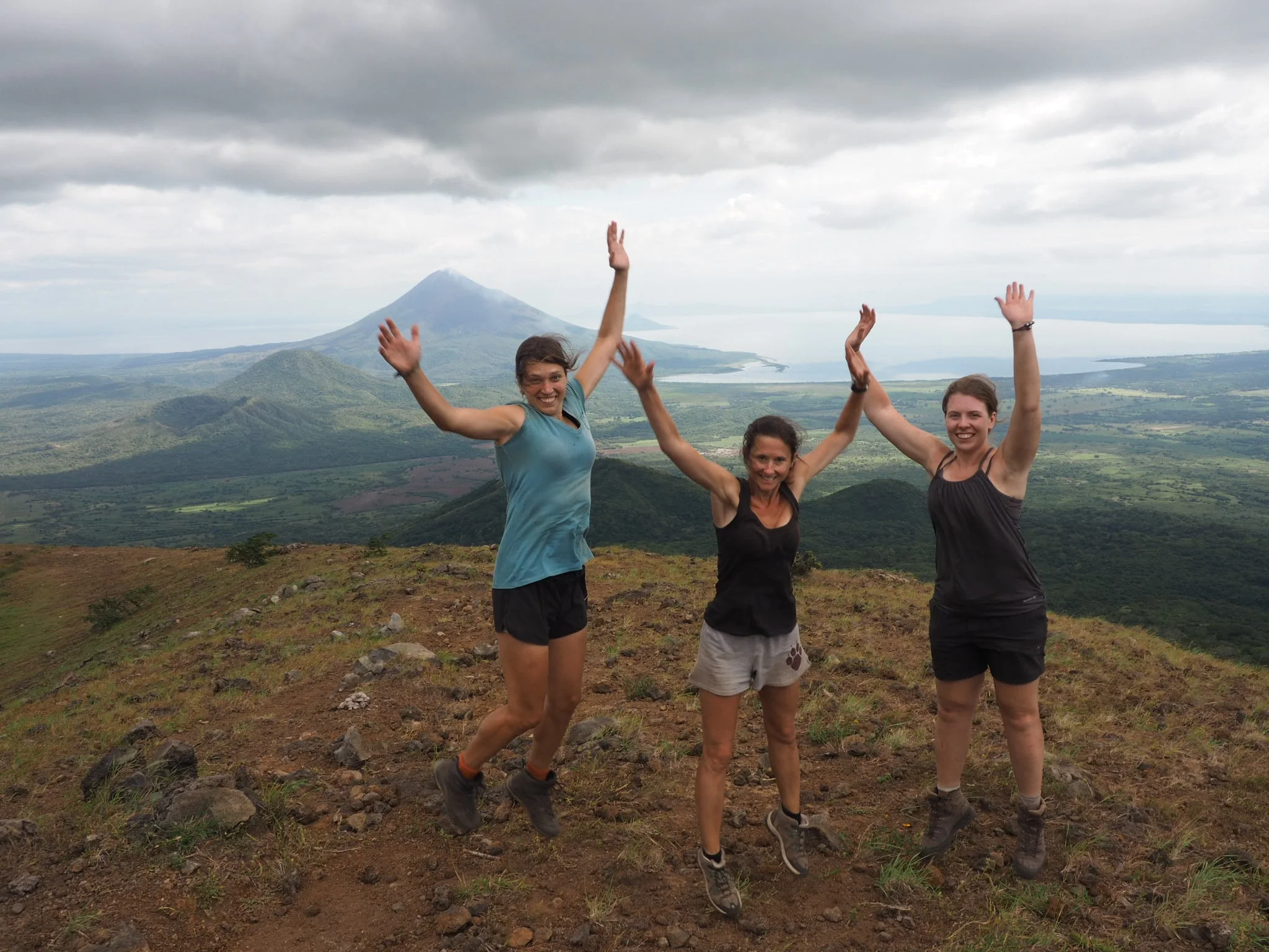 Day 14 of trek, on the top of the final mountain, still wearing the same clothes. Not sure what is tan and what is dirt. We look awkwardly photoshopped, but I assure you, we're not.&nbsp;
