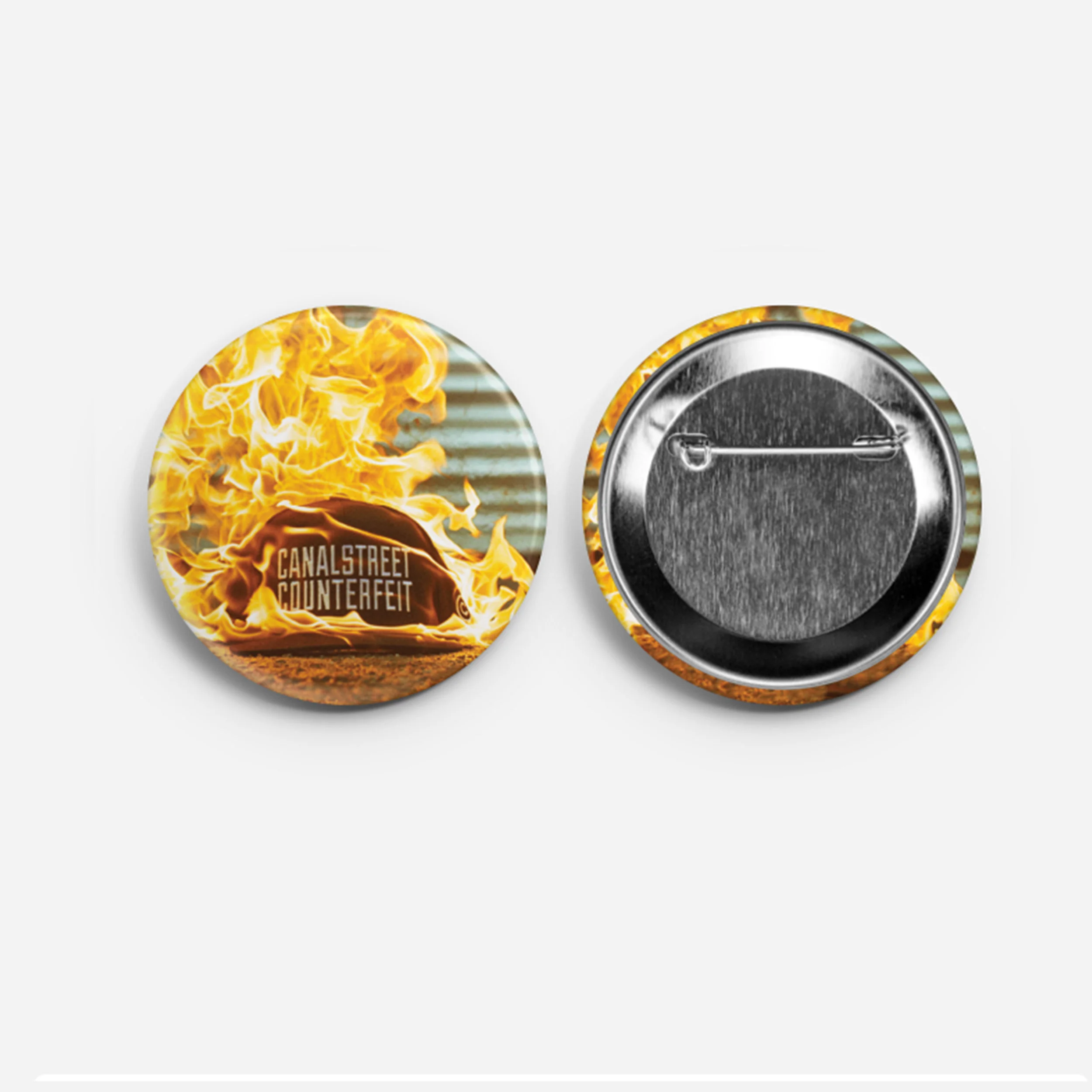 burningcap_button_web.jpg
