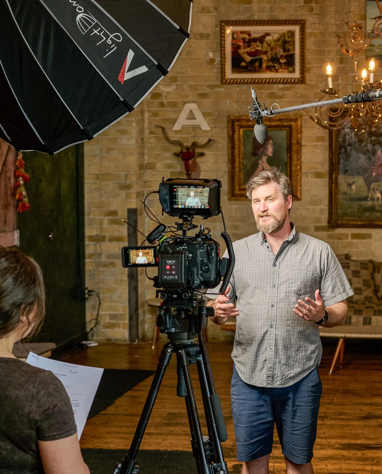 minneapolis videographer, training videos, youtube videos, social media content creators, man speaks on microphone in front of video camera