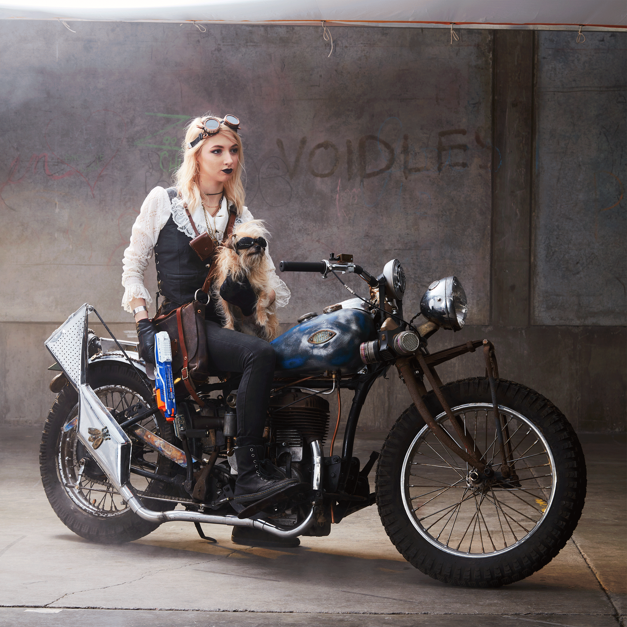 blonde young woman in diesel-punk outfit and small dog, minneapolis retoucher