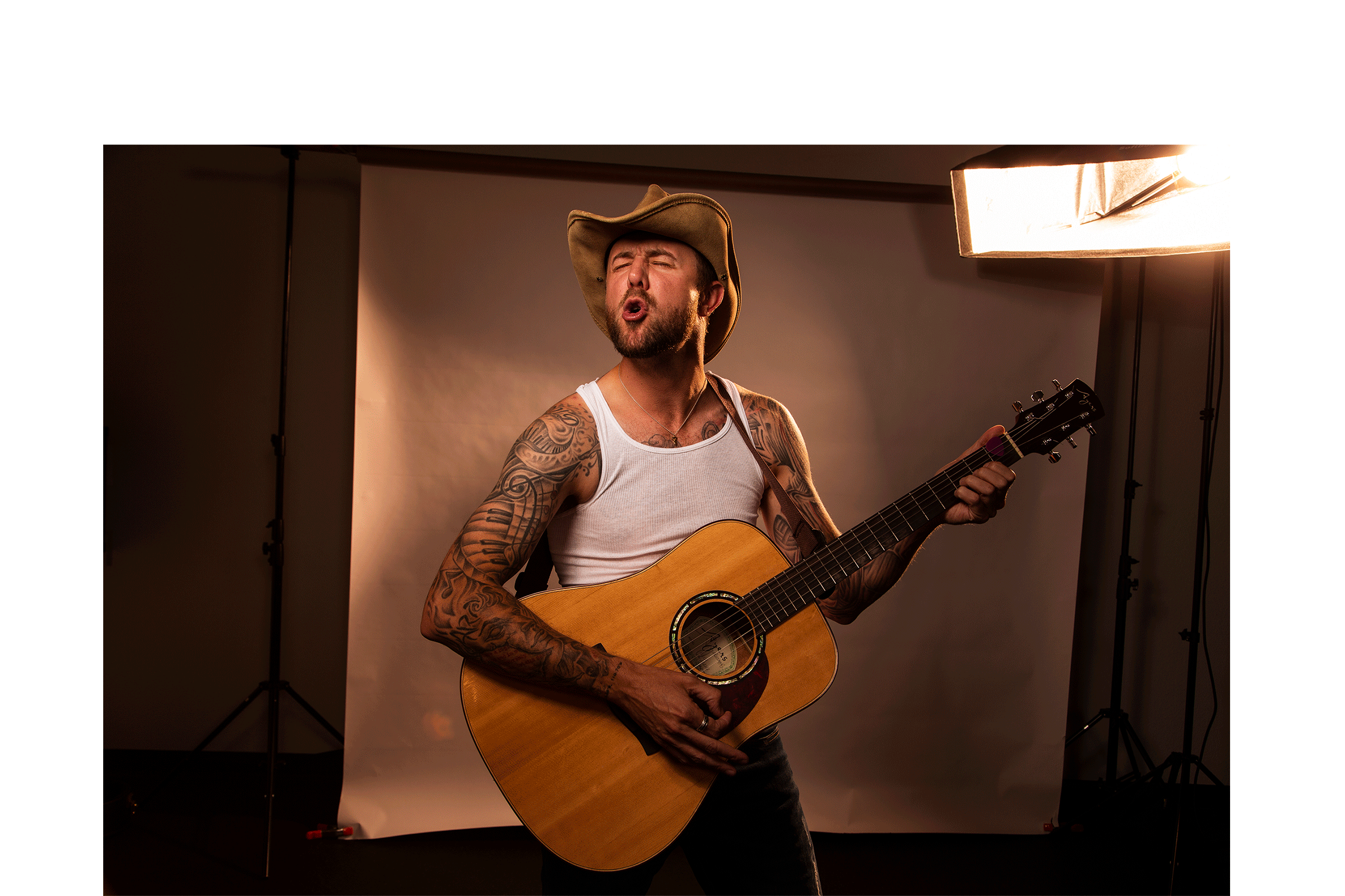 country musician singing in studio magically appears on stage, minneapolis digital retouching
