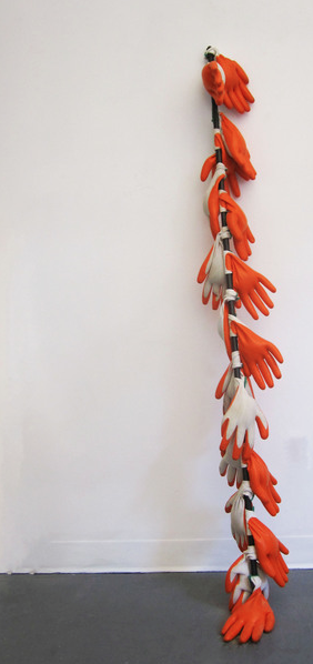  spare &nbsp; ;  Resembling a leaning branch, this sculpture is body-sized. &nbsp;The gloves are porous and sand leaks from their insides, marking the passage of time and changing shape as they shed. &nbsp;The gloves signify the domestic and labor wh