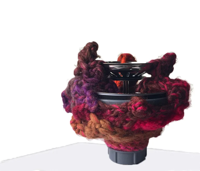 pelvis : detail sink drain, yarn. 56 x 6 x 6 inches In the shape of a Greek Urn or Amphora, this shape references a classic vessel, which suggests the uterus and the maternal. In reference to the tradition of women's handiwork and fetish objects, I crochet fibers around artifacts or domestic detritus found on the streets of NYC - transforming them. I liken this process to the maternal with gestures that, at their best heal and nurture and at their worst - smother and confine