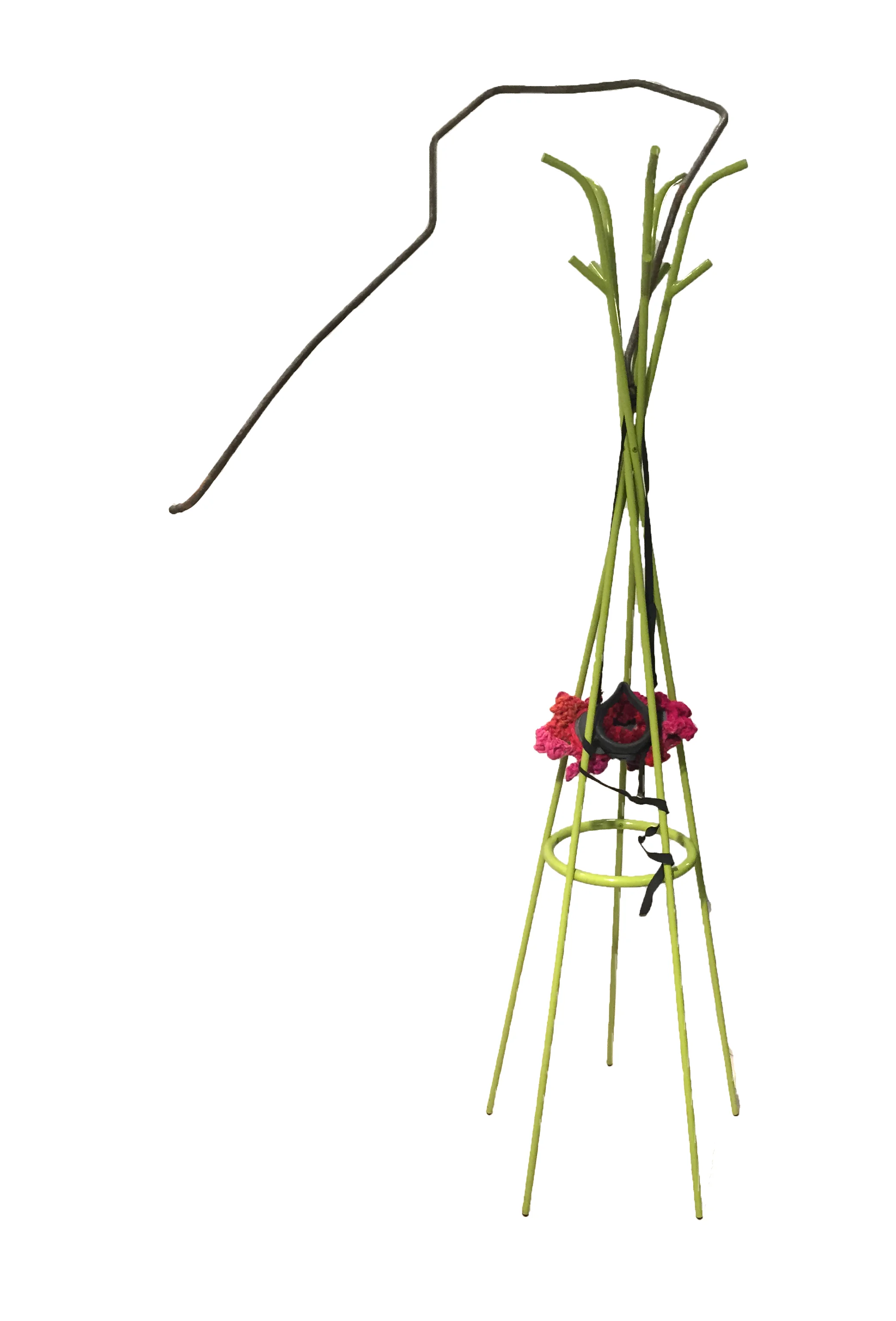 birth tree 2016, 79 x 38 x 25 inches. Found coatrack, brake line, air mask, yarn. A found air mask becomes a uterus with leafy ovaries. A coatrack sprouting a brake line, becomes a tree-like form. The tree is an archetypal symbol of breath, healing, connection. The Druids and Celtic mysticism believed that certain trees were sacred and birth dates, associated with certain trees could predict personality types. 