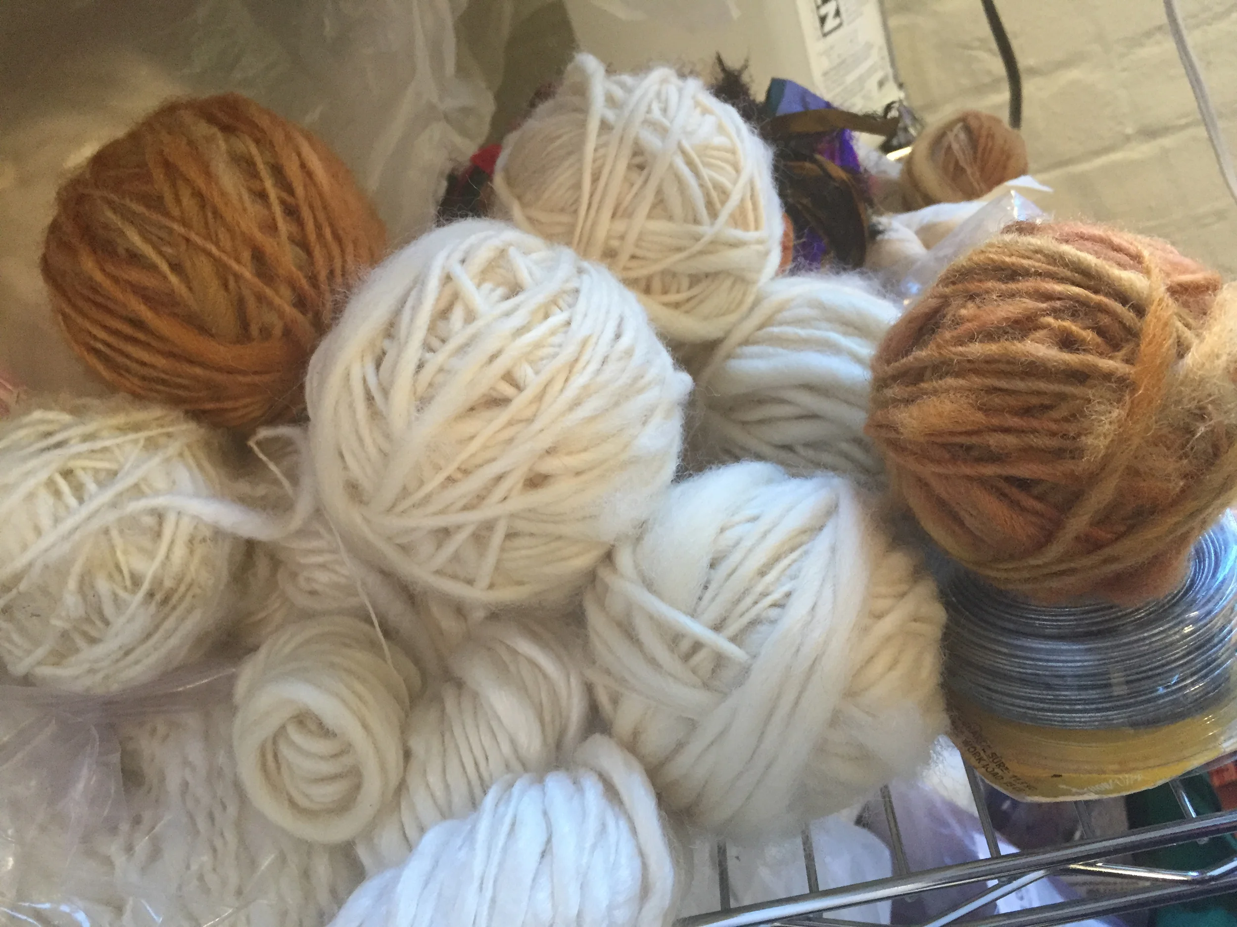 Handspun yarn. Furthest left was done on a drop spindle, the others with a borrowed spinning wheel. The golden yarn was spun from fleece given to me by someone who raised the sheep and dyed the yarn herself, which adds a communal effort to the materials.