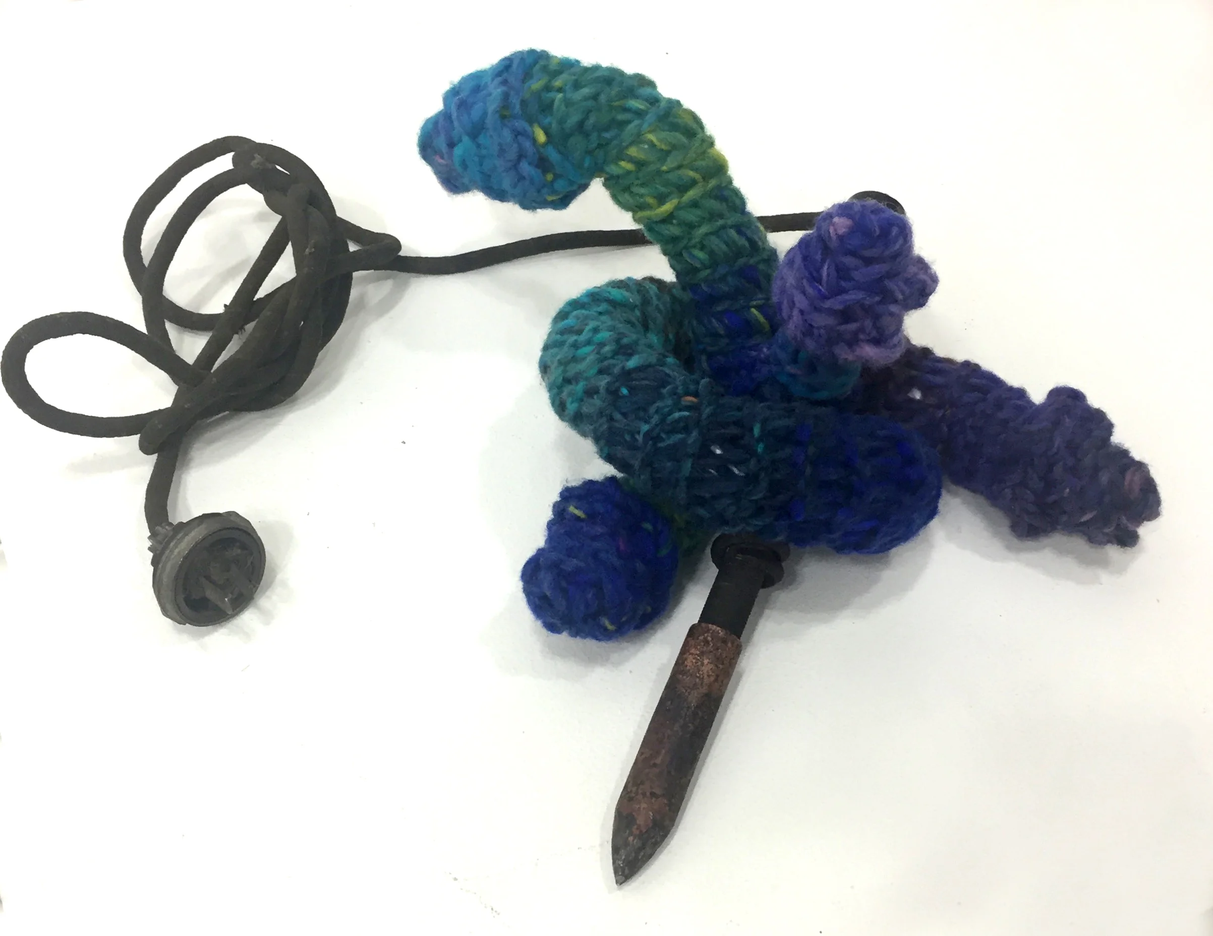 seduced by a serpent/ soldered in the garden vintage soldering iron, yarn, up-cycled grocery bags 6 x 12 x 15 inches bonding/joining/uniting and references to the fall of mankind