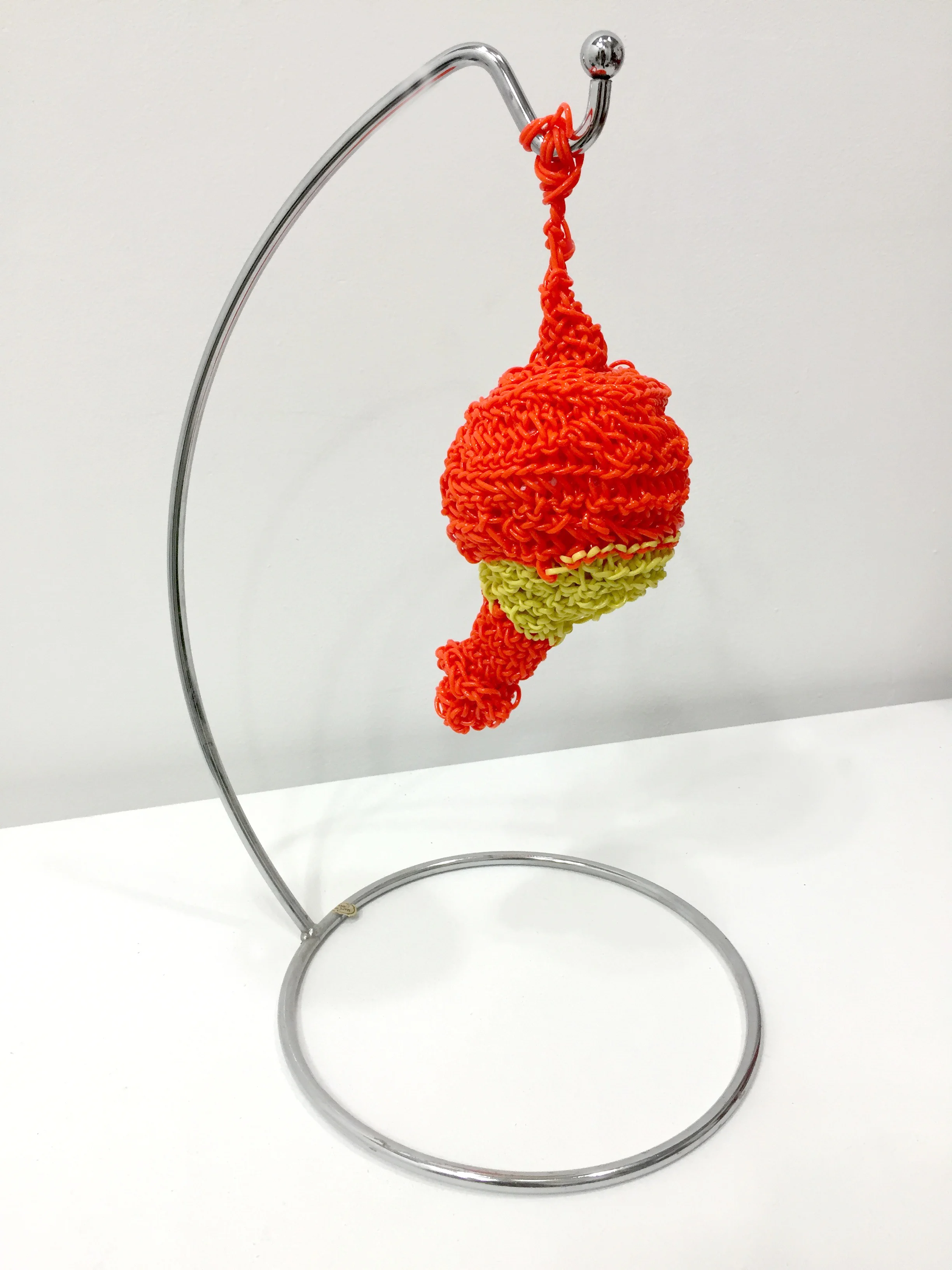 make banana holders great again banana holder, plastic string, up-cycled grocery bags (stuffing) 17 x 10 x 10 inches a micro penis in yellow and orange.