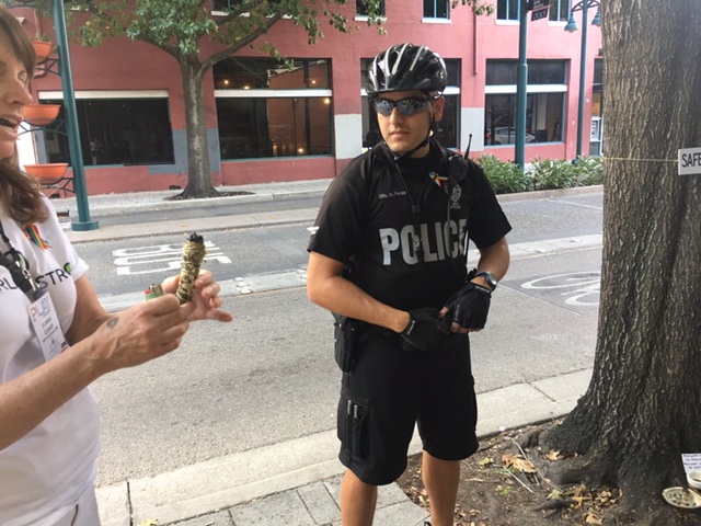  detail, safe haven  Smudging two or Orlando's police force prior to the Pride parade.  "Anything that will keep the peace is good with me." 