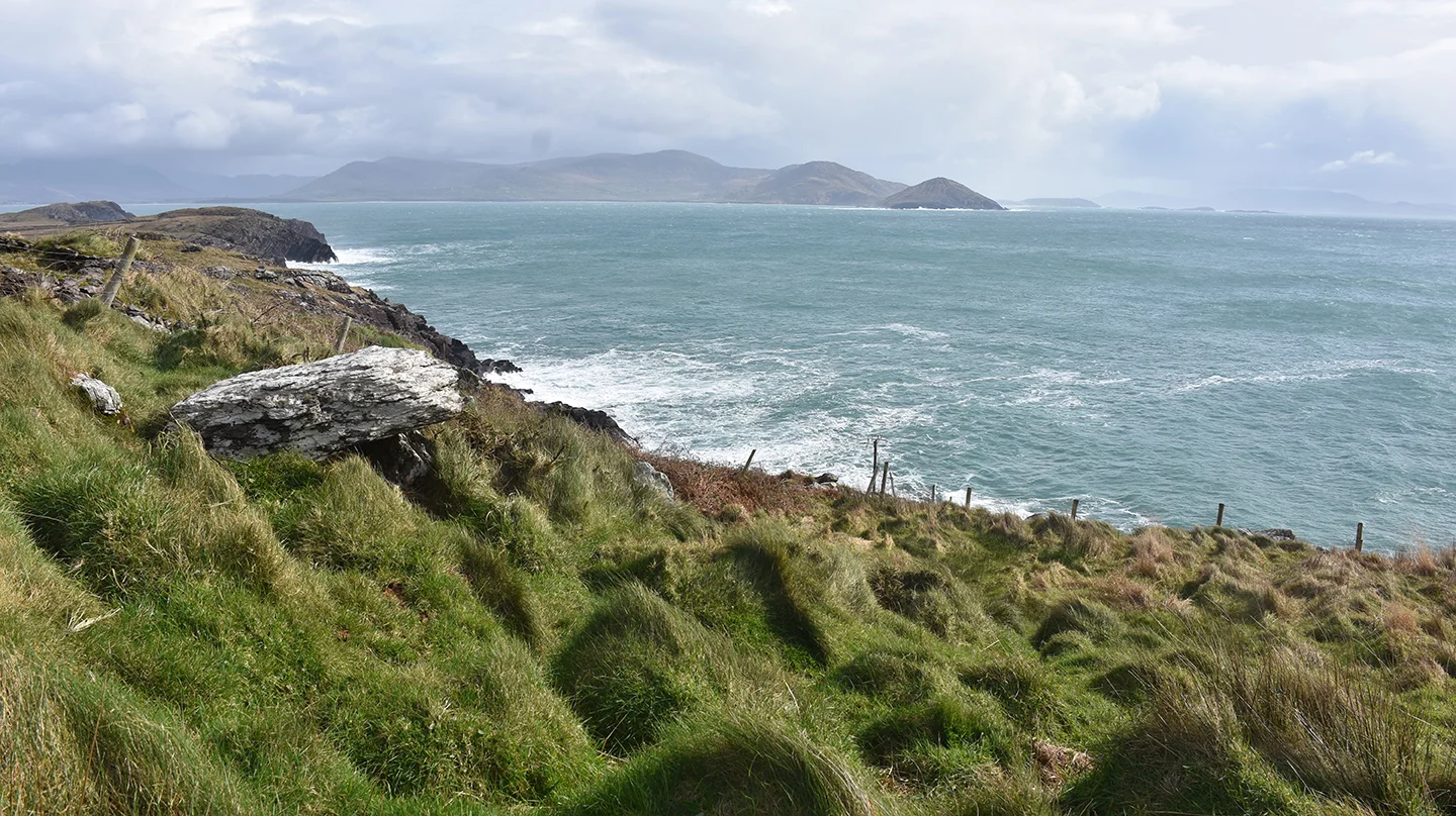 Not a shabby view either.  That white stone protruding out of from the left is actually part of a burial ground.  Cillins ring the coast.  Apparently, one is always in sight of another.  They are where un-baptised babies were bur…